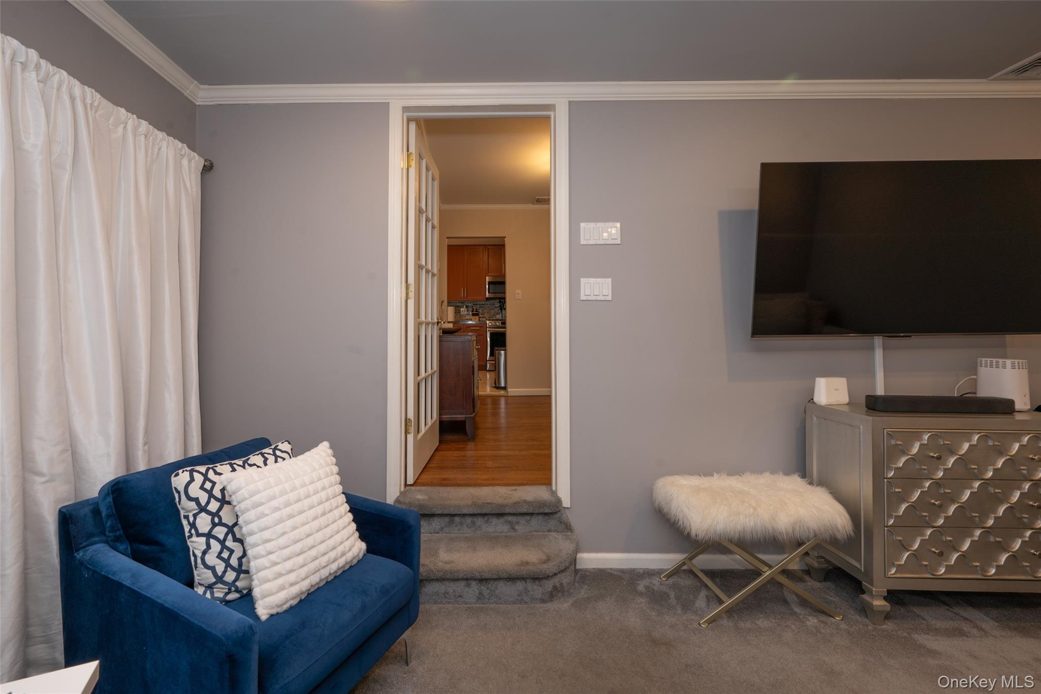 211 Gardner Avenue Jericho, NY 11753 - Photo 11 of 36 a living room with furniture and a flat screen tv