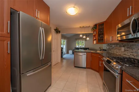 a kitchen with a sink cabinets and stainless steel appliances