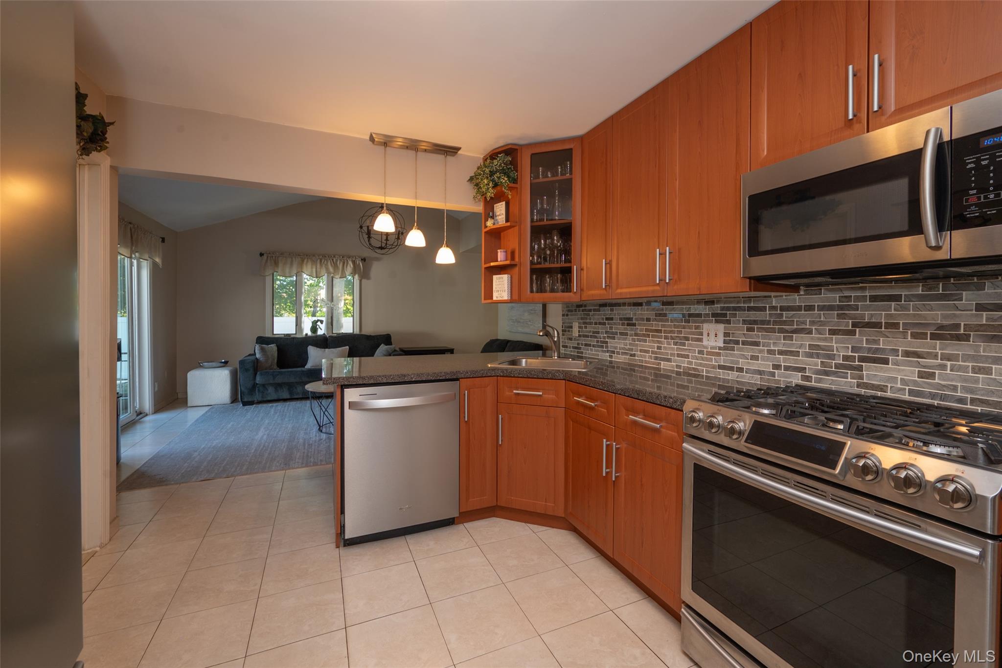 211 Gardner Avenue Jericho, NY 11753 - Photo 33 of 36 a kitchen with a sink cabinets and stainless steel appliances