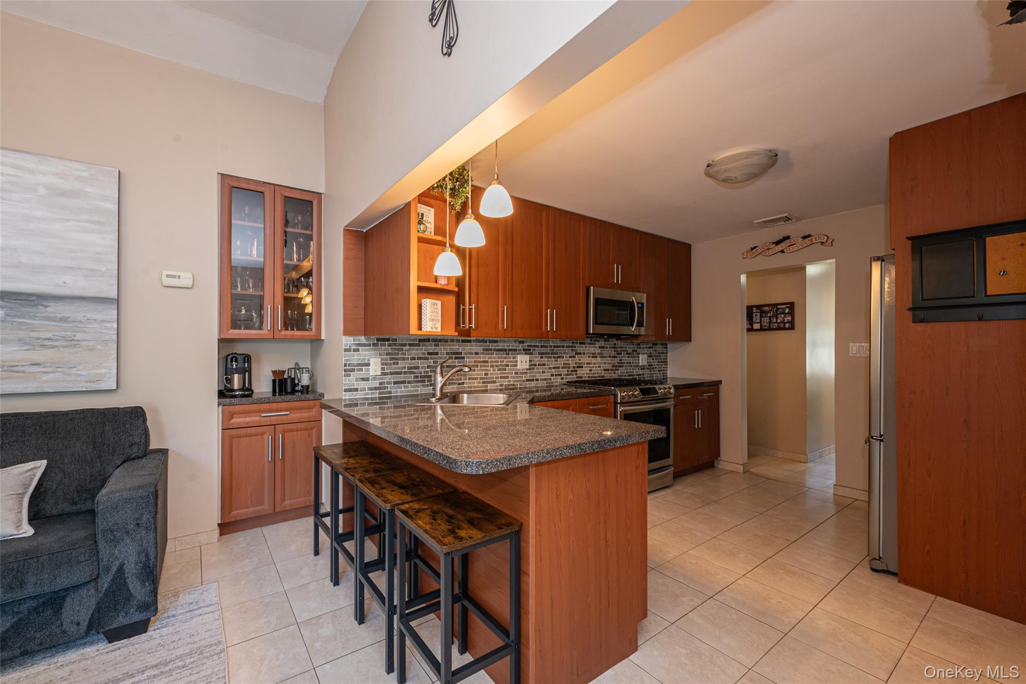 211 Gardner Avenue Jericho, NY 11753 - Photo 16 of 36 a kitchen with stainless steel appliances granite countertop a sink stove and refrigerator