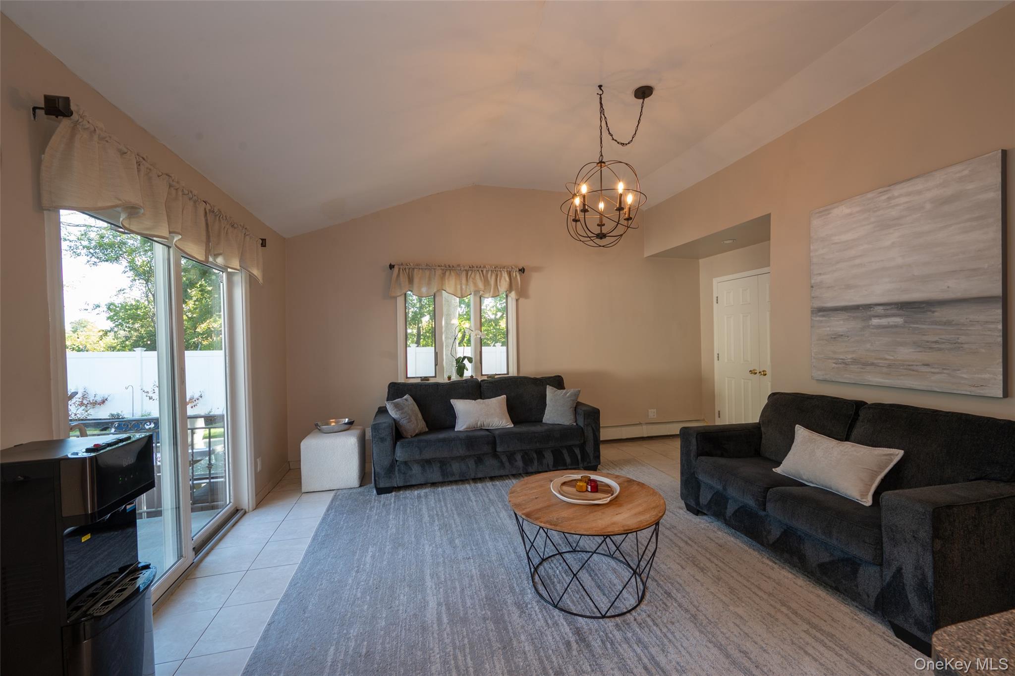 211 Gardner Avenue Jericho, NY 11753 - Photo 17 of 36 a living room with furniture and a wooden floor