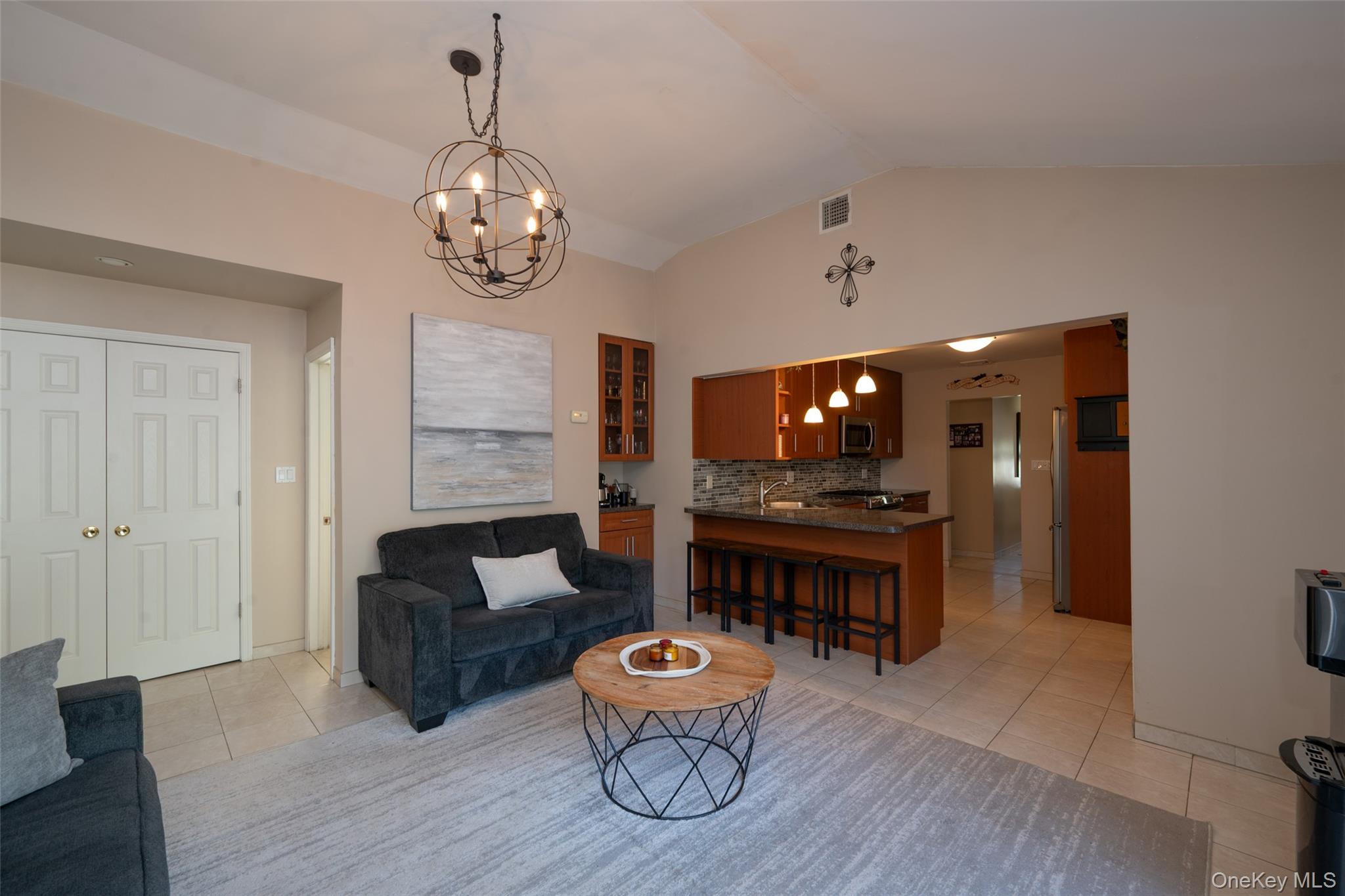 211 Gardner Avenue Jericho, NY 11753 - Photo 18 of 36 a dining room with furniture a rug and wooden floor