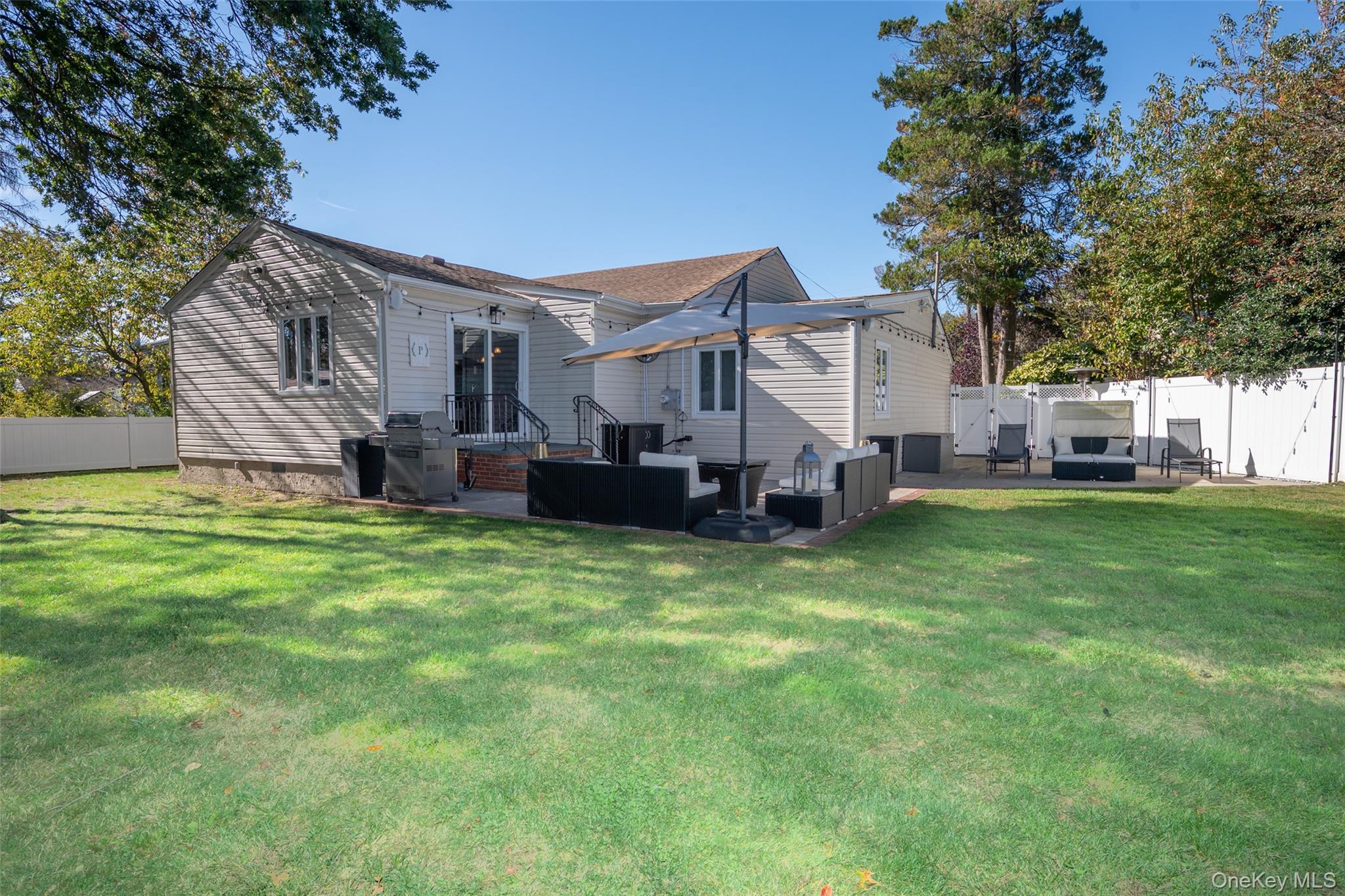211 Gardner Avenue Jericho, NY 11753 - Photo 31 of 36 a view of a house with a big yard plants and large trees