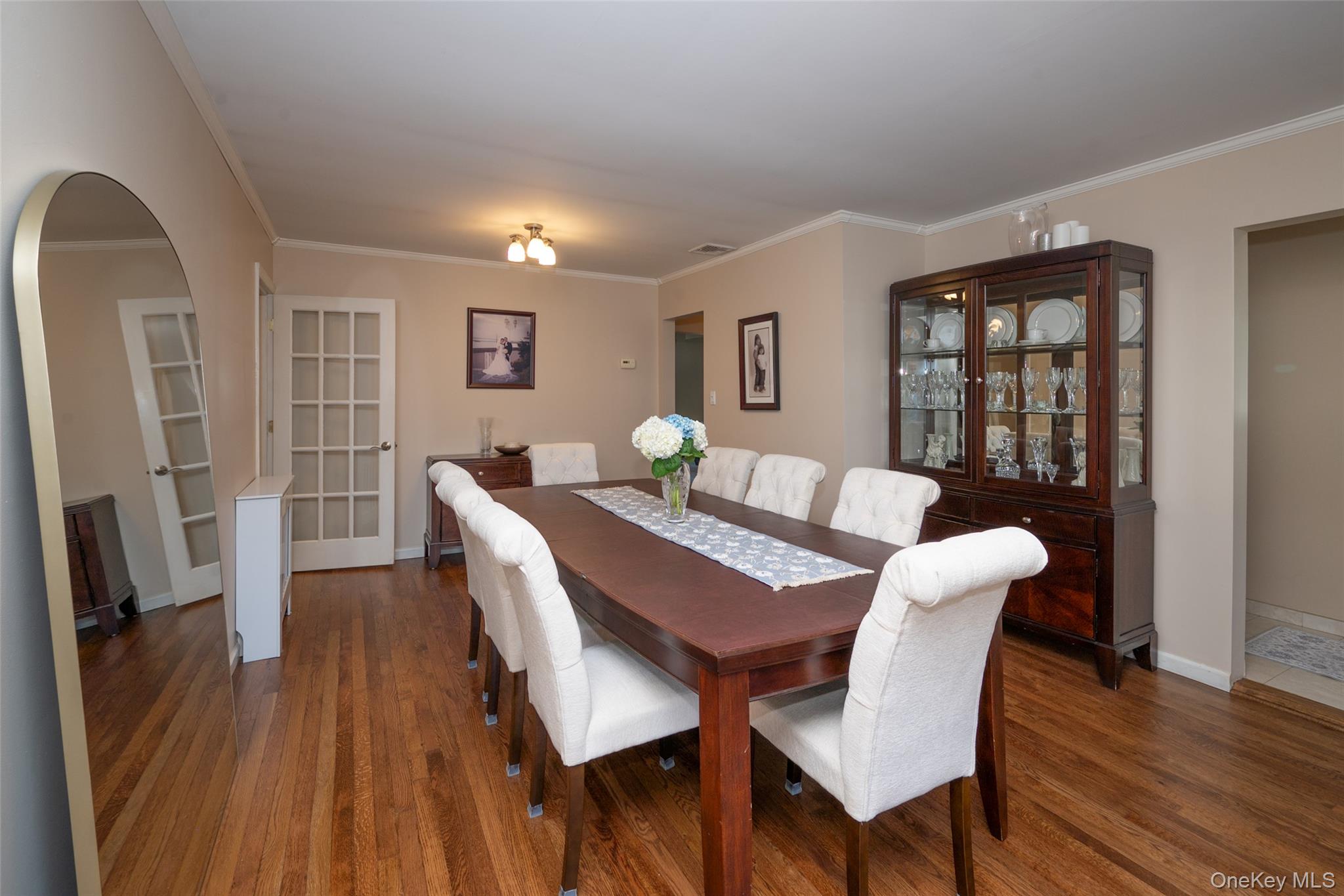 211 Gardner Avenue Jericho, NY 11753 - Photo 7 of 36 a view of a dining room with furniture window and wooden floor