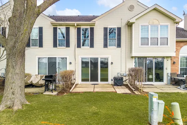 a house view with swimming pool in front of it