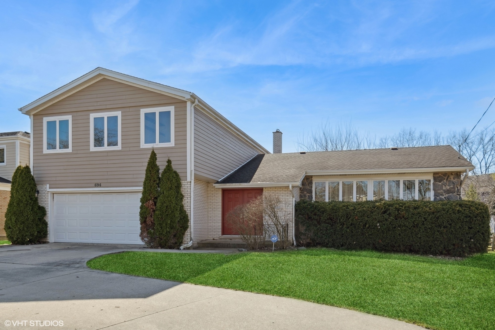 694 Ridge Road Highland Park, IL 60035 - Photo 1 of 27 a view of house with backyard and garden