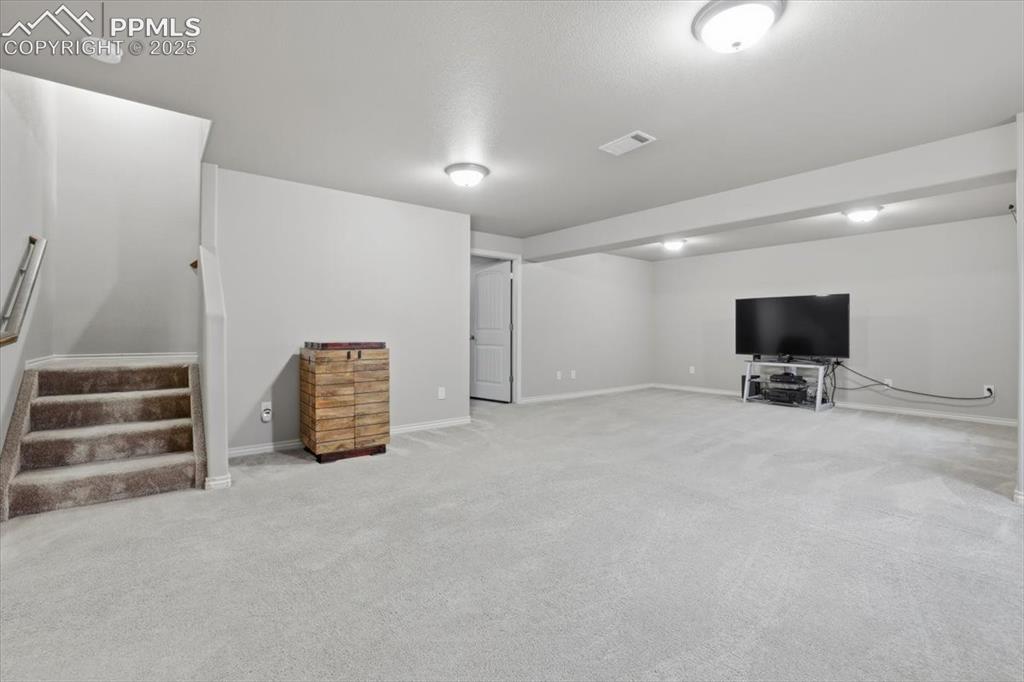 2374 Cinnabar Road Colorado Springs, CO 80921 - Photo 41 of 47 The basement level family room is HUGE and has different "zones" for various activities.