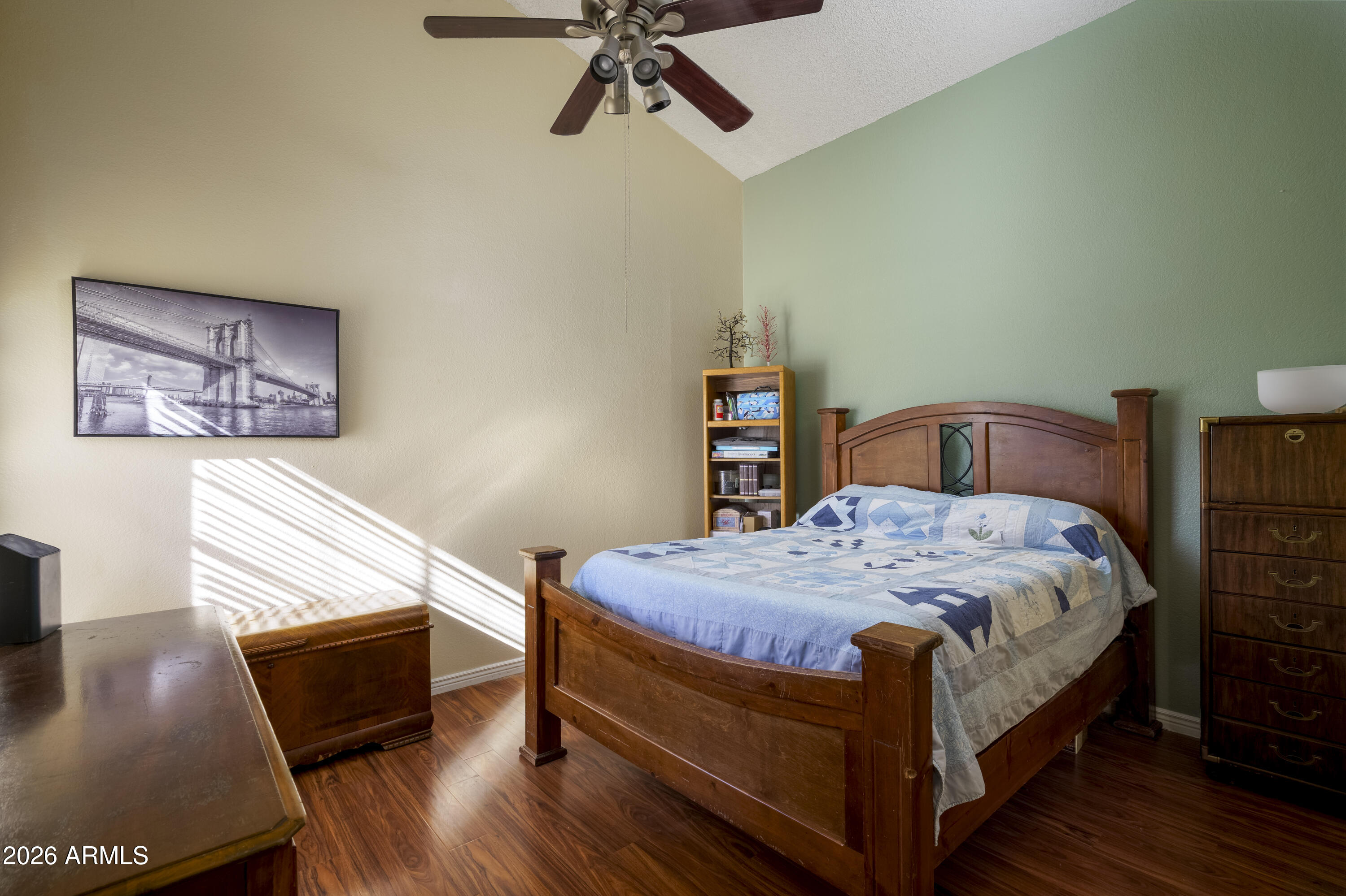 3030 South Alma School Road, Unit 28 Mesa, AZ 85202 - Photo 11 of 17 a bedroom with a bed and wooden floor