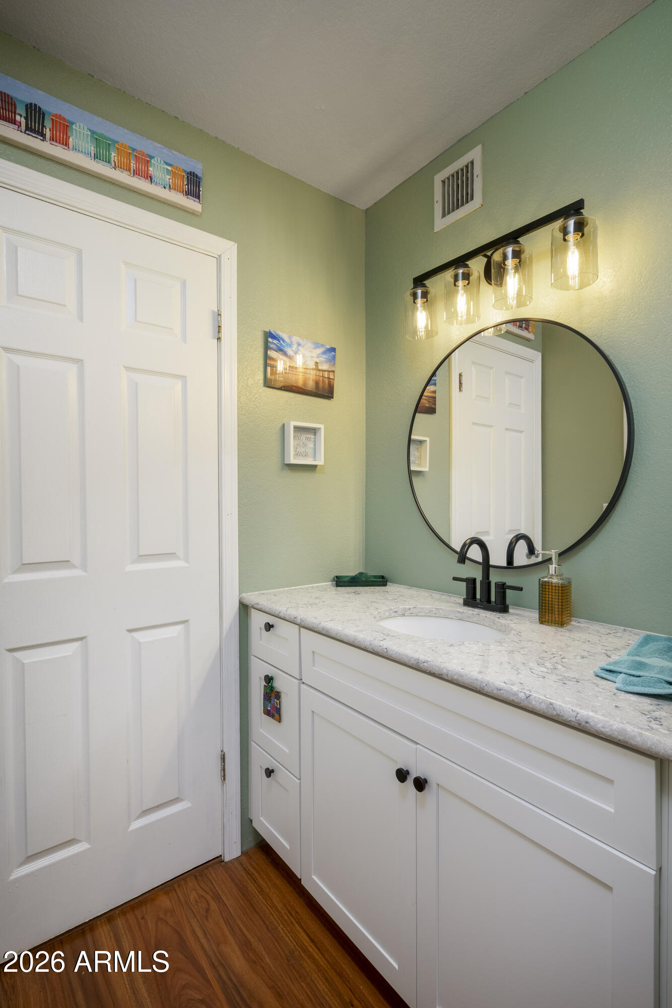 3030 South Alma School Road, Unit 28 Mesa, AZ 85202 - Photo 13 of 17 a bathroom with a granite countertop sink and a mirror
