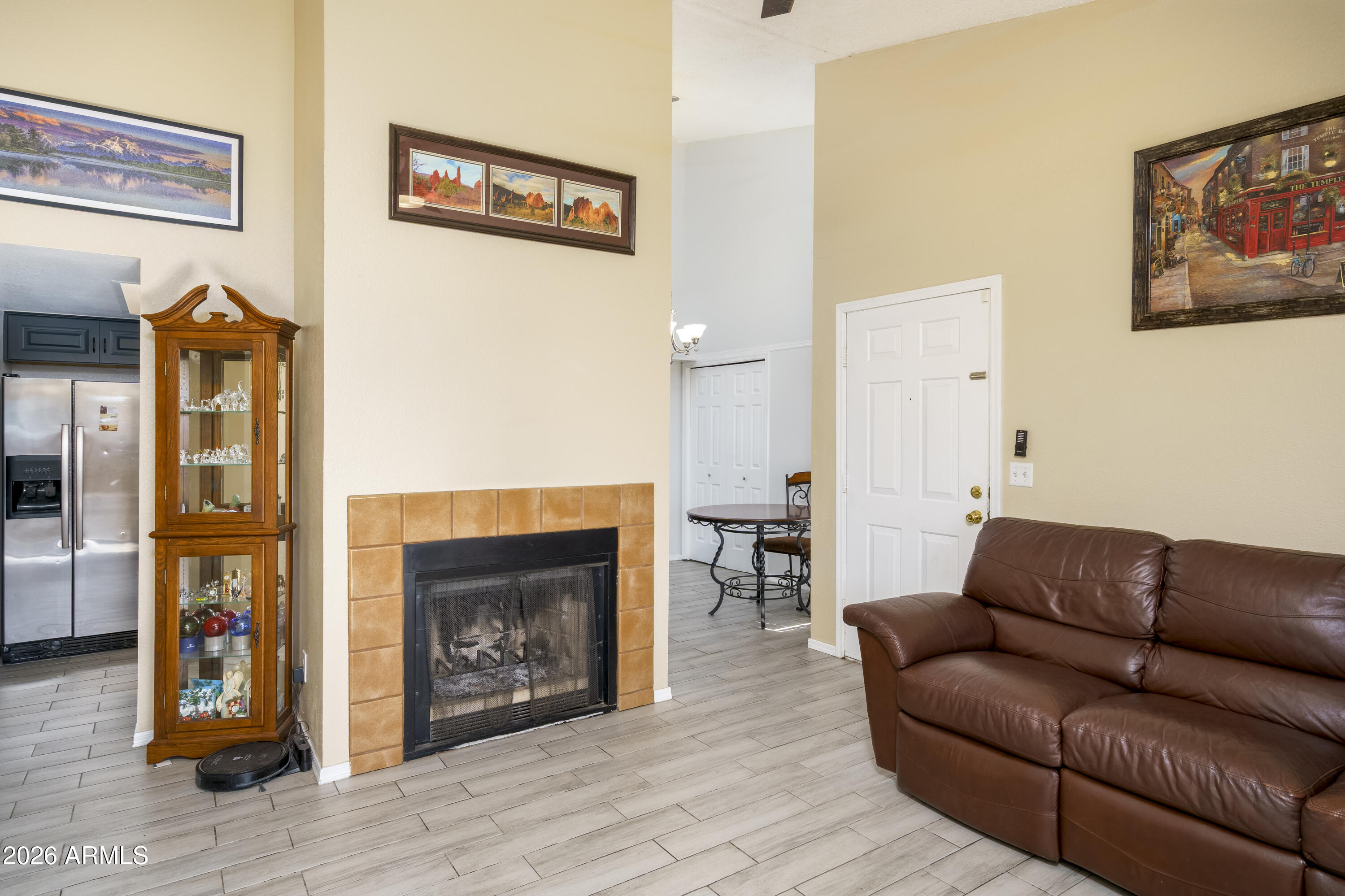 3030 South Alma School Road, Unit 28 Mesa, AZ 85202 - Photo 6 of 17 a living room with furniture and a fireplace