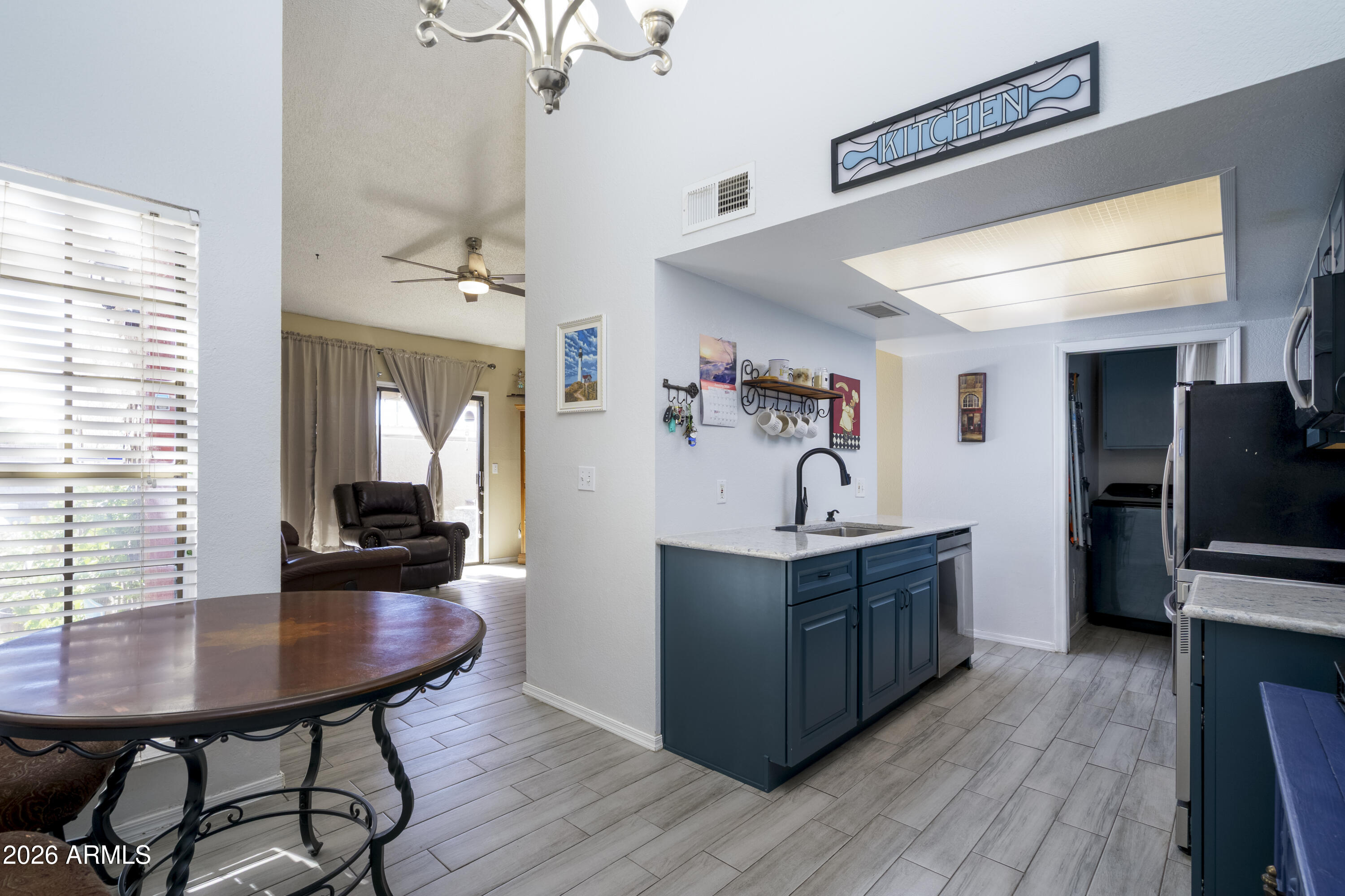 3030 South Alma School Road, Unit 28 Mesa, AZ 85202 - Photo 7 of 17 a living room with furniture and a flat screen tv