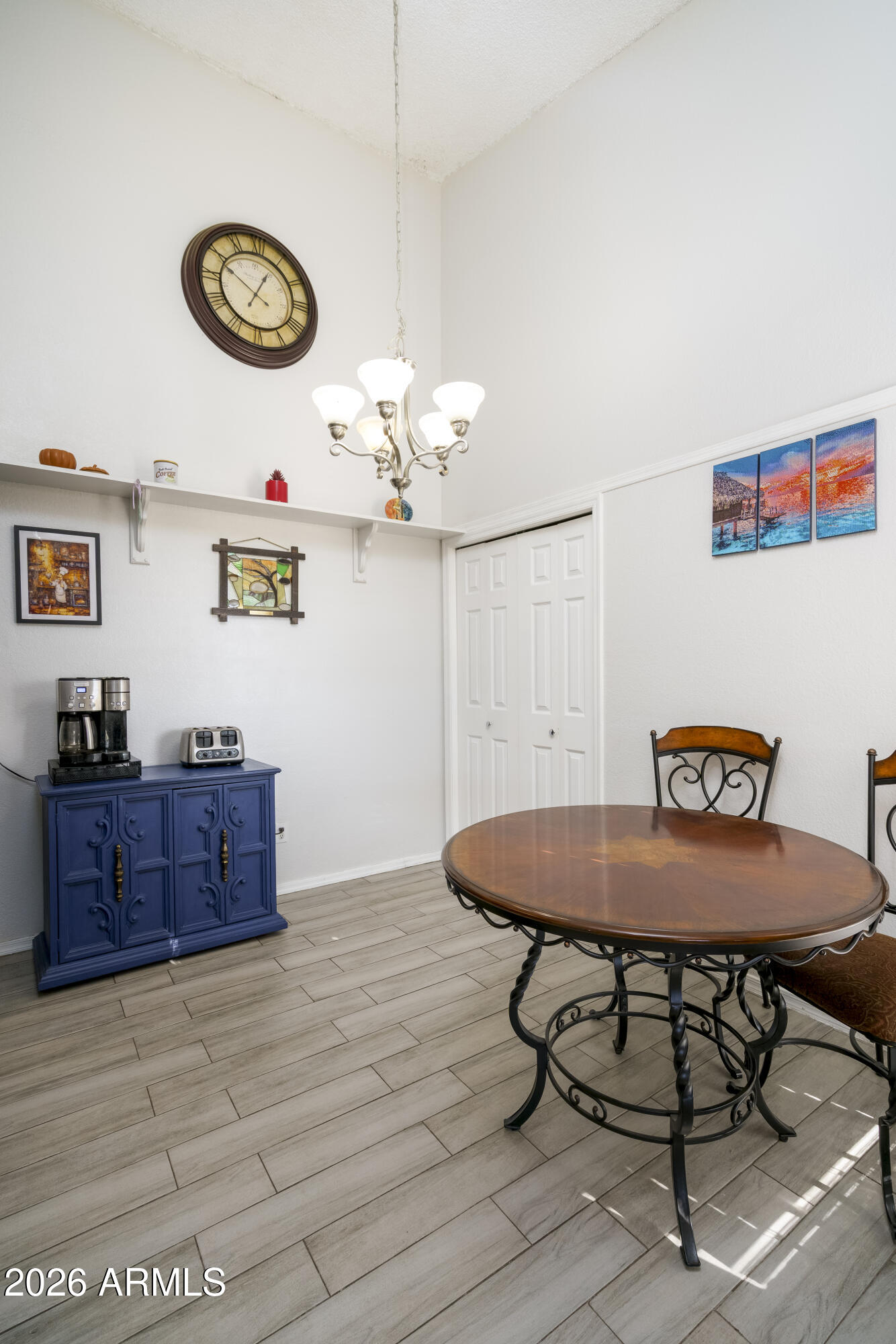 3030 South Alma School Road, Unit 28 Mesa, AZ 85202 - Photo 10 of 17 a room with a table and chandelier