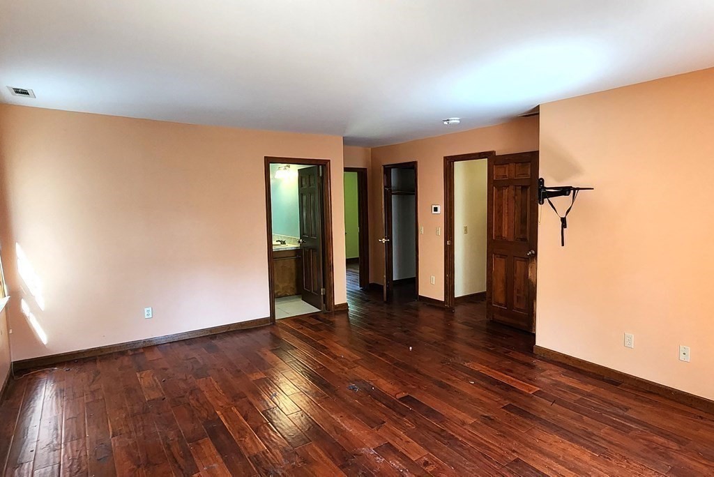 12 Woodsley Road Wilbraham, MA 01095 - Photo 12 of 15 wooden floor in an empty room with a window