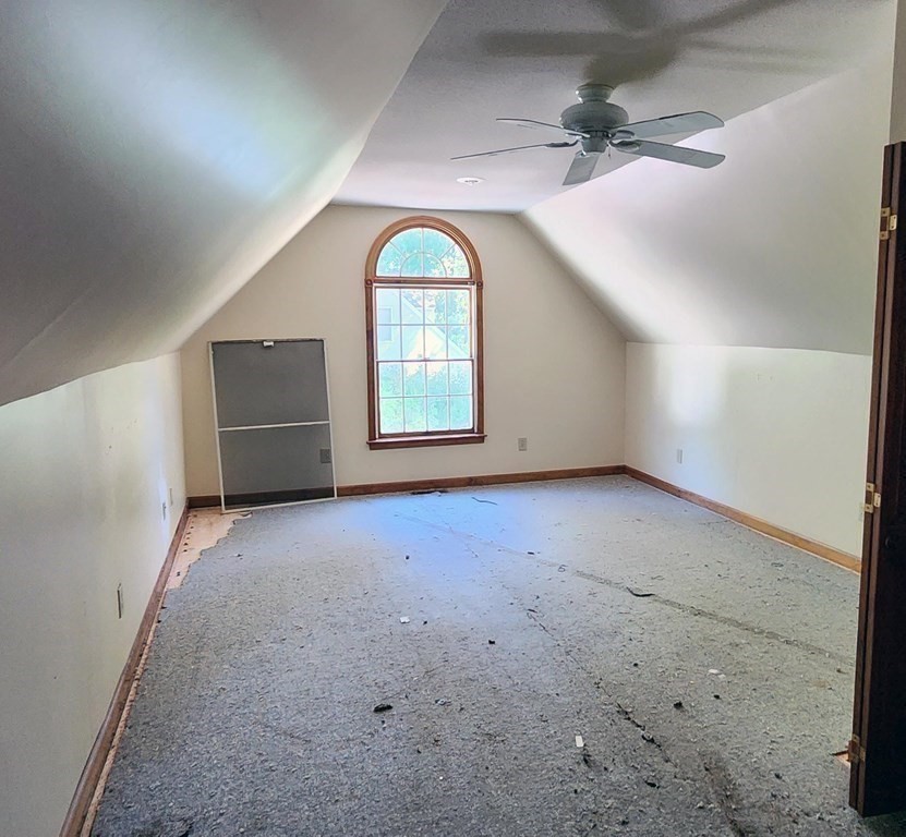 12 Woodsley Road Wilbraham, MA 01095 - Photo 15 of 15 an empty room with windows and ceiling fan