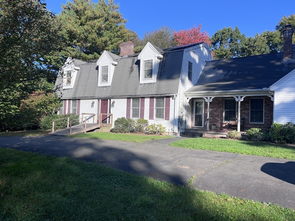12 Woodsley Road Wilbraham, MA 01095 - Photo 2 of 15 a front view of a house with a yard and garage