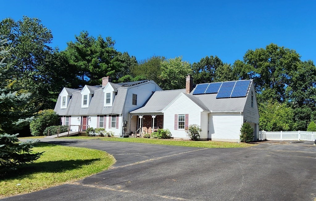 12 Woodsley Road Wilbraham, MA 01095 - Photo 3 of 15 a front view of a house with a garden
