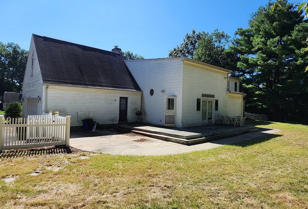 12 Woodsley Road Wilbraham, MA 01095 - Photo 4 of 15 a view of the house with backyard and trees