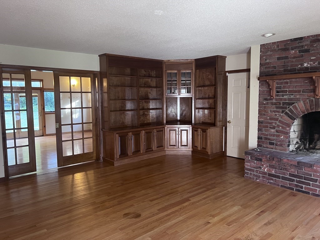 12 Woodsley Road Wilbraham, MA 01095 - Photo 8 of 15 a living room with stainless steel appliances wooden floor and view kitchen