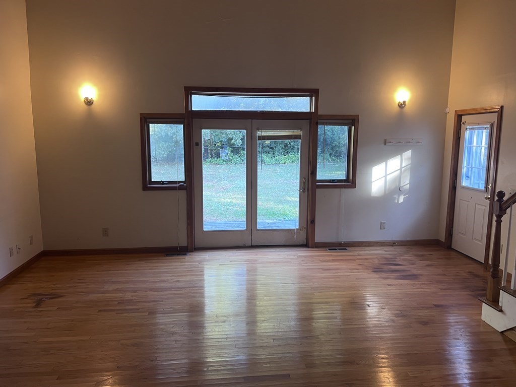 12 Woodsley Road Wilbraham, MA 01095 - Photo 10 of 15 an empty room with wooden floor and windows
