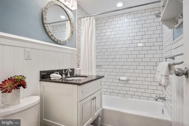 a bathroom with a sink a bathtub and a shower