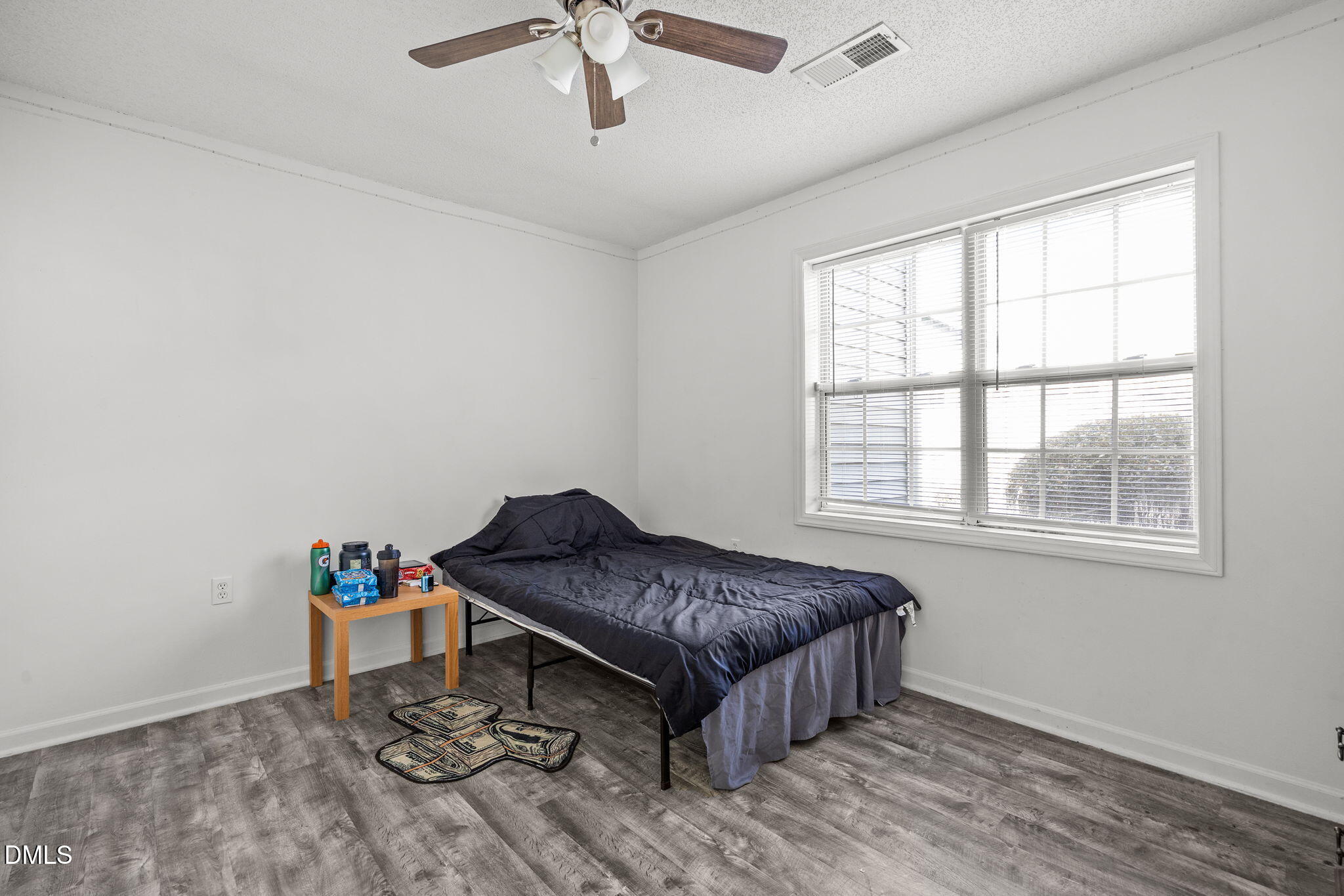 1305 Kent Road, Unit 101 Raleigh, NC 27606 - Photo 10 of 29 a living room with a bed furniture and next to a window