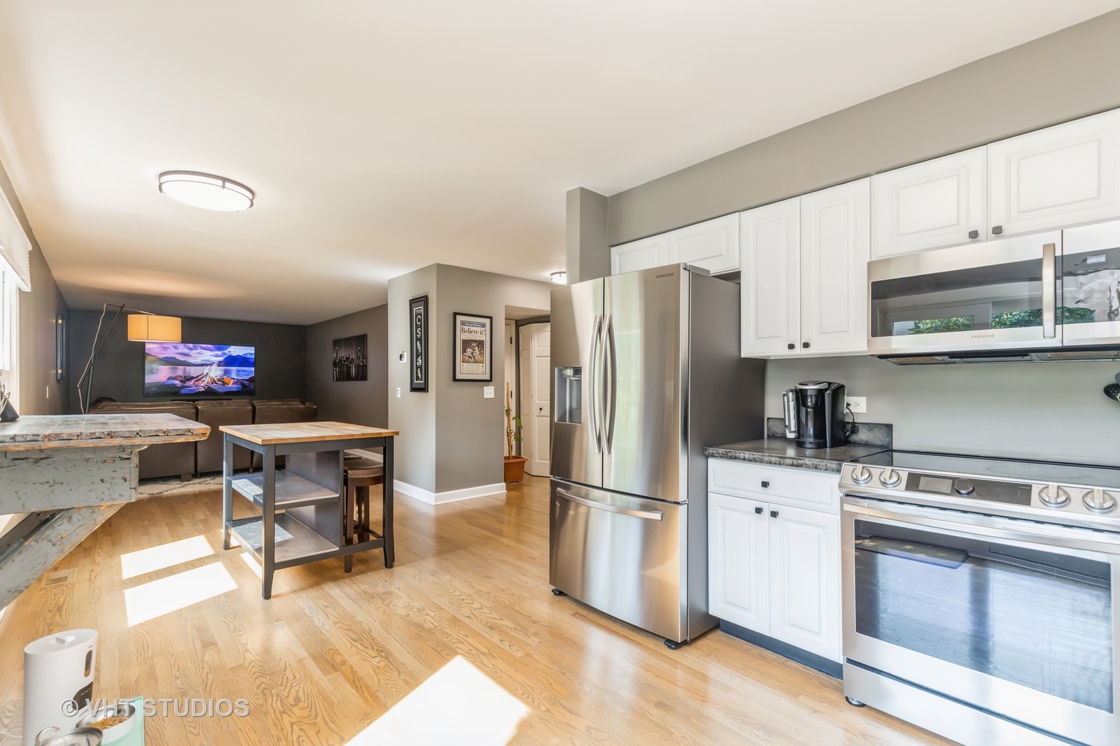 317 Old Hunt Road Fox River Grove, IL 60021 - Photo 16 of 22 a kitchen with stainless steel appliances a stove a sink cabinets and a refrigerator