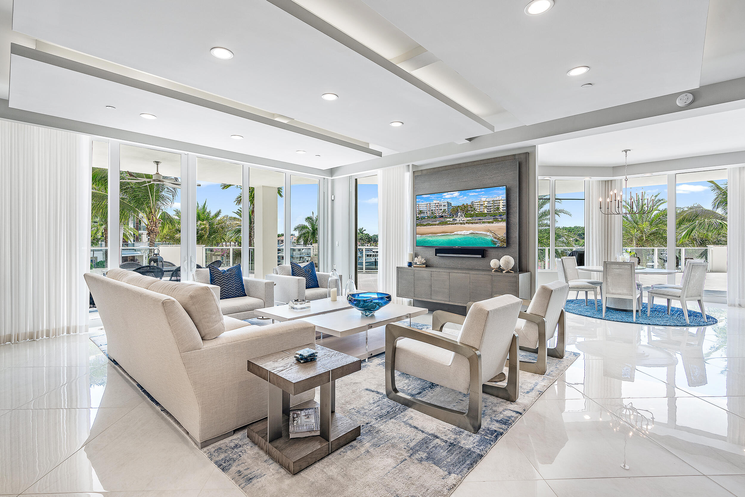 2720 Donald Ross Road, Unit 203 Palm Beach Gardens, FL 33410 - Photo 4 of 35 a living room with fireplace furniture and a flat screen tv