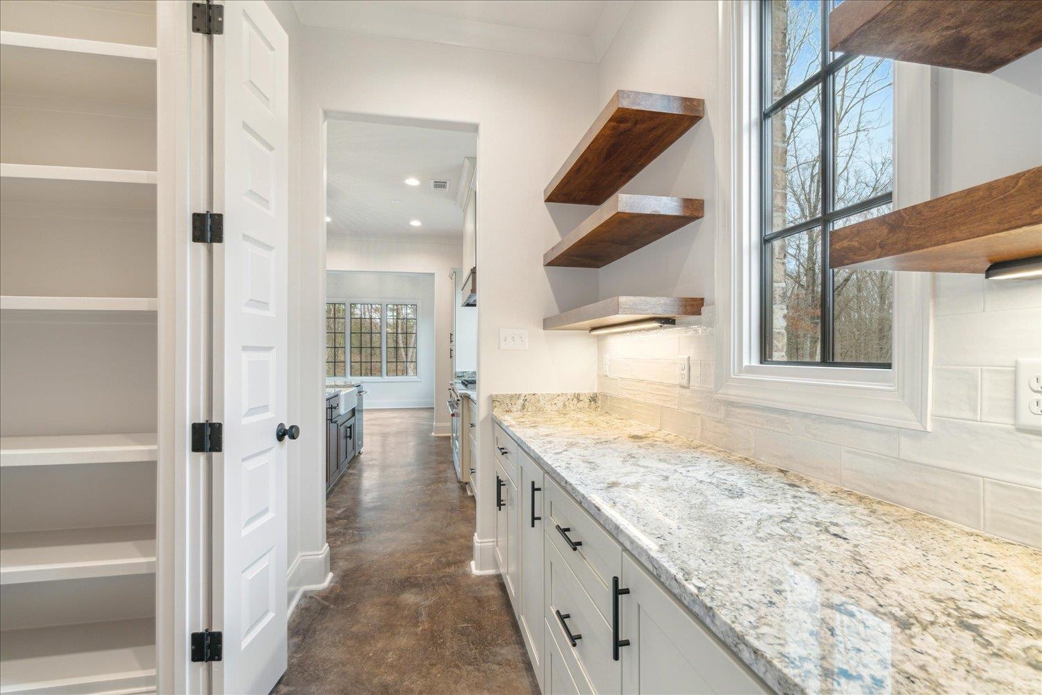 45 Magnolia Cove Piperton, TN 38017 - Photo 19 of 40 a bathroom with a granite countertop sink and a window
