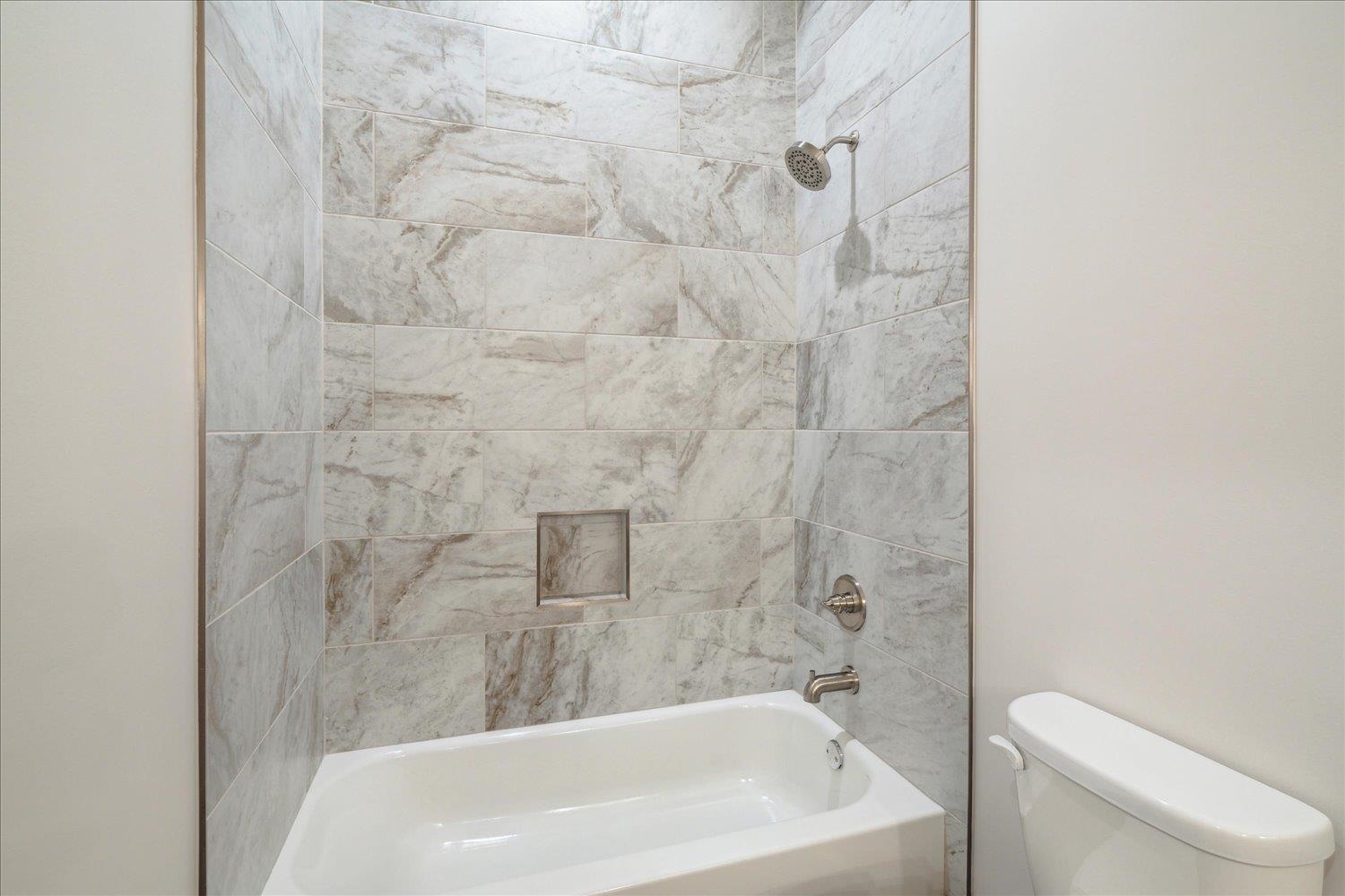 45 Magnolia Cove Piperton, TN 38017 - Photo 29 of 40 a bathroom with a white bath tub