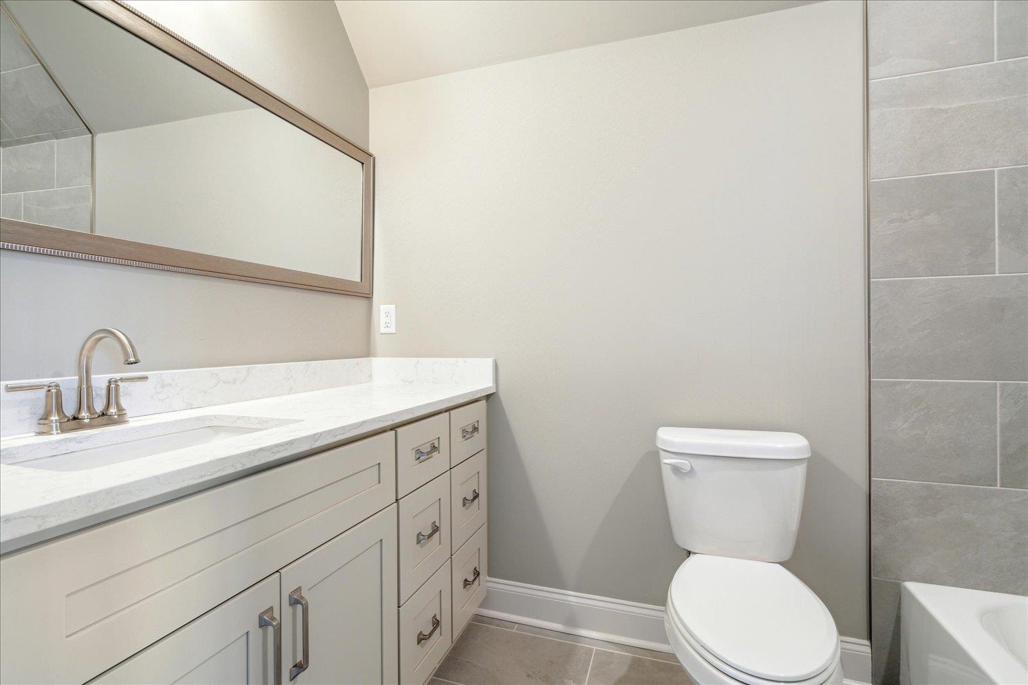 45 Magnolia Cove Piperton, TN 38017 - Photo 33 of 40 a bathroom with a toilet sink and mirror