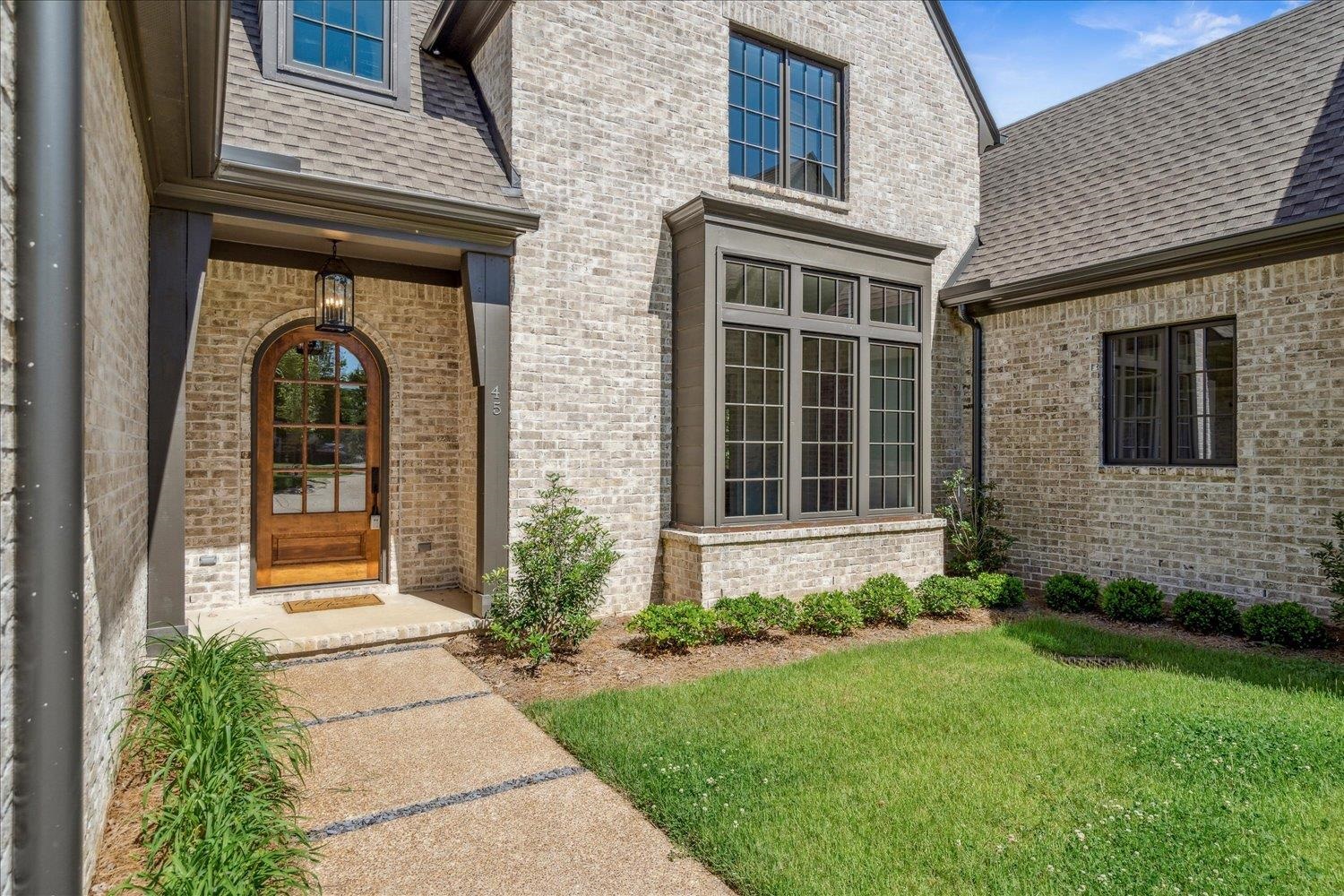45 Magnolia Cove Piperton, TN 38017 - Photo 4 of 40 a front view of a house with garden