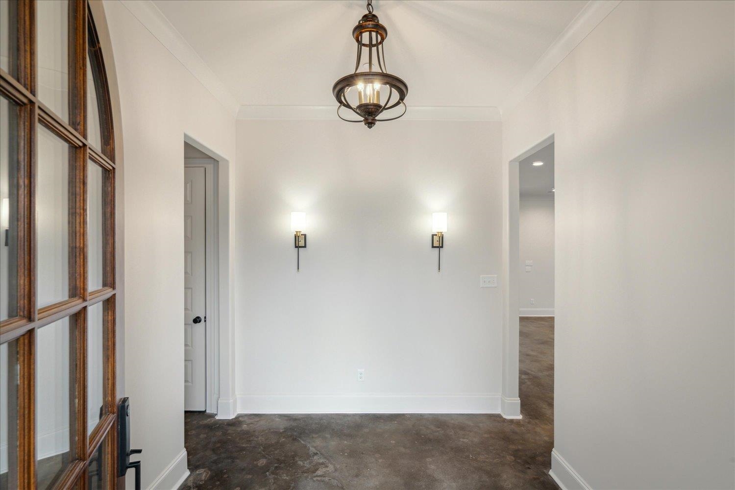 45 Magnolia Cove Piperton, TN 38017 - Photo 5 of 40 a view of a hallway with a chandelier