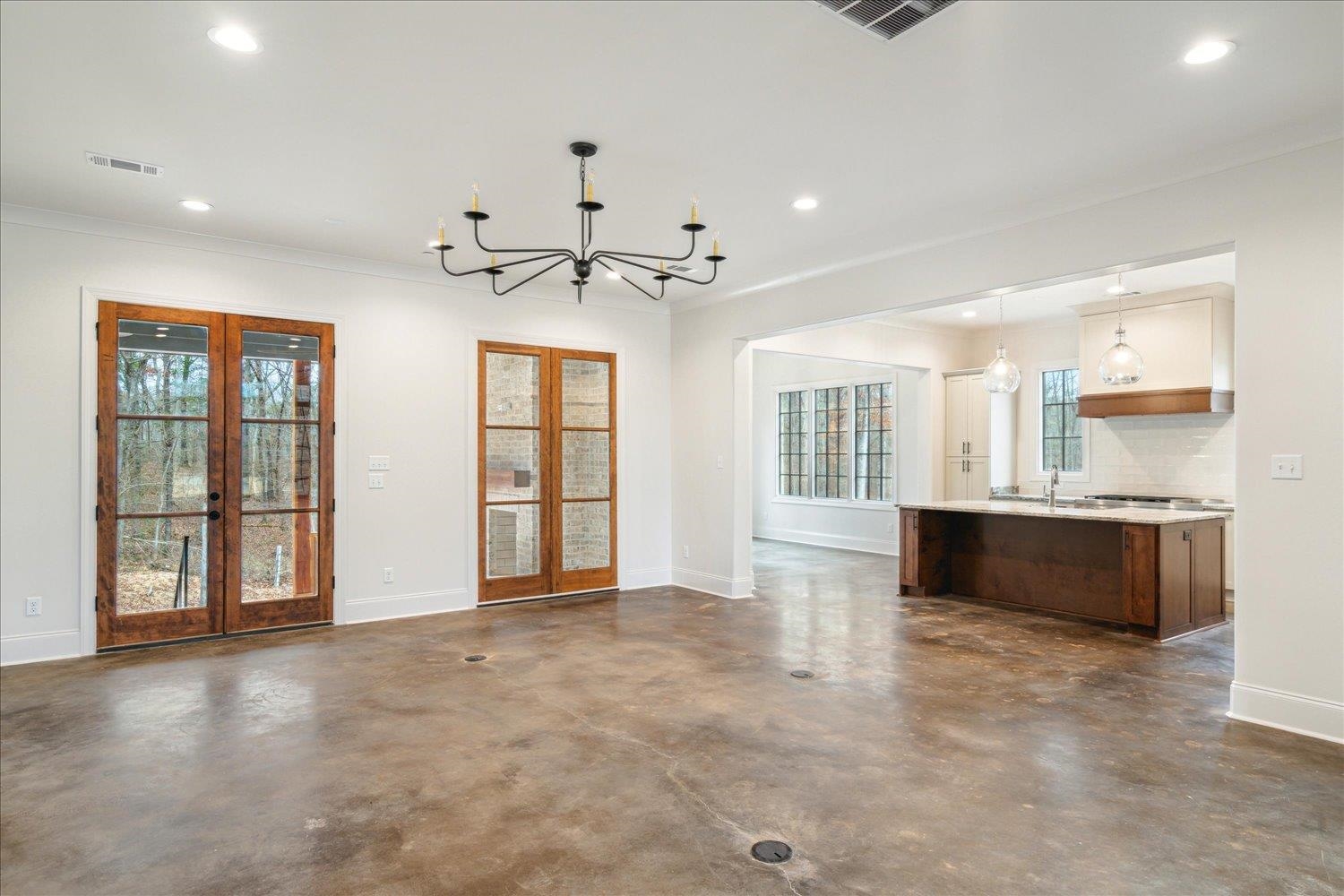 45 Magnolia Cove Piperton, TN 38017 - Photo 9 of 40 a view of an empty room with a kitchen