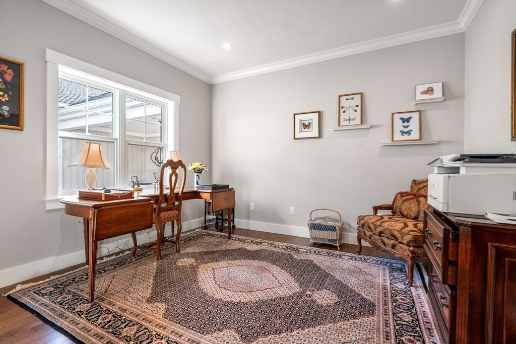 69 Abbey Road, Unit 69 Westwood, MA 02090 - Photo 8 of 16 a living room with furniture a rug and a window
