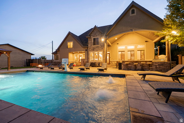 687 South 2080th Street East Springville, UT 84663 - Photo 143 of 149 Expansive backyard with a rectangular swimming pool featuring a water fountain