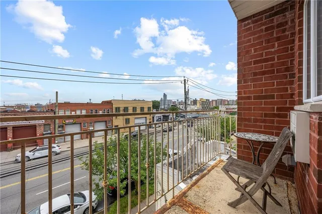 a view of a balcony with a chairs
