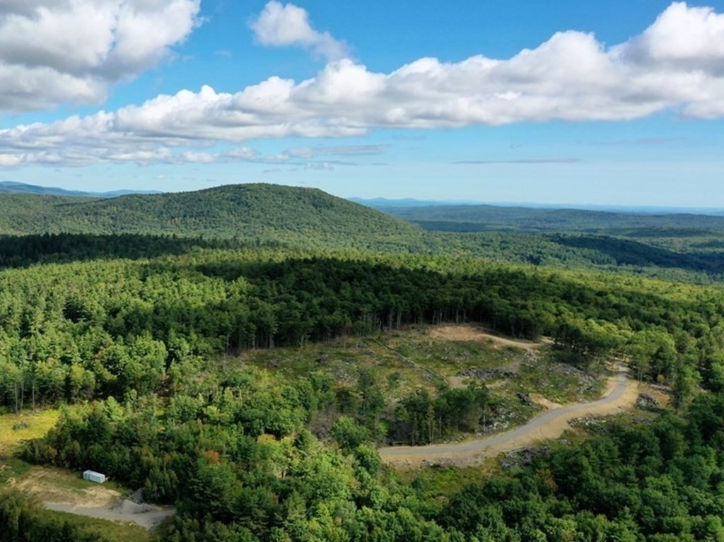 0 Stowell Road Ashburnham, MA 01430 - Photo 1 of 11 a view of a lake with a mountain in the background