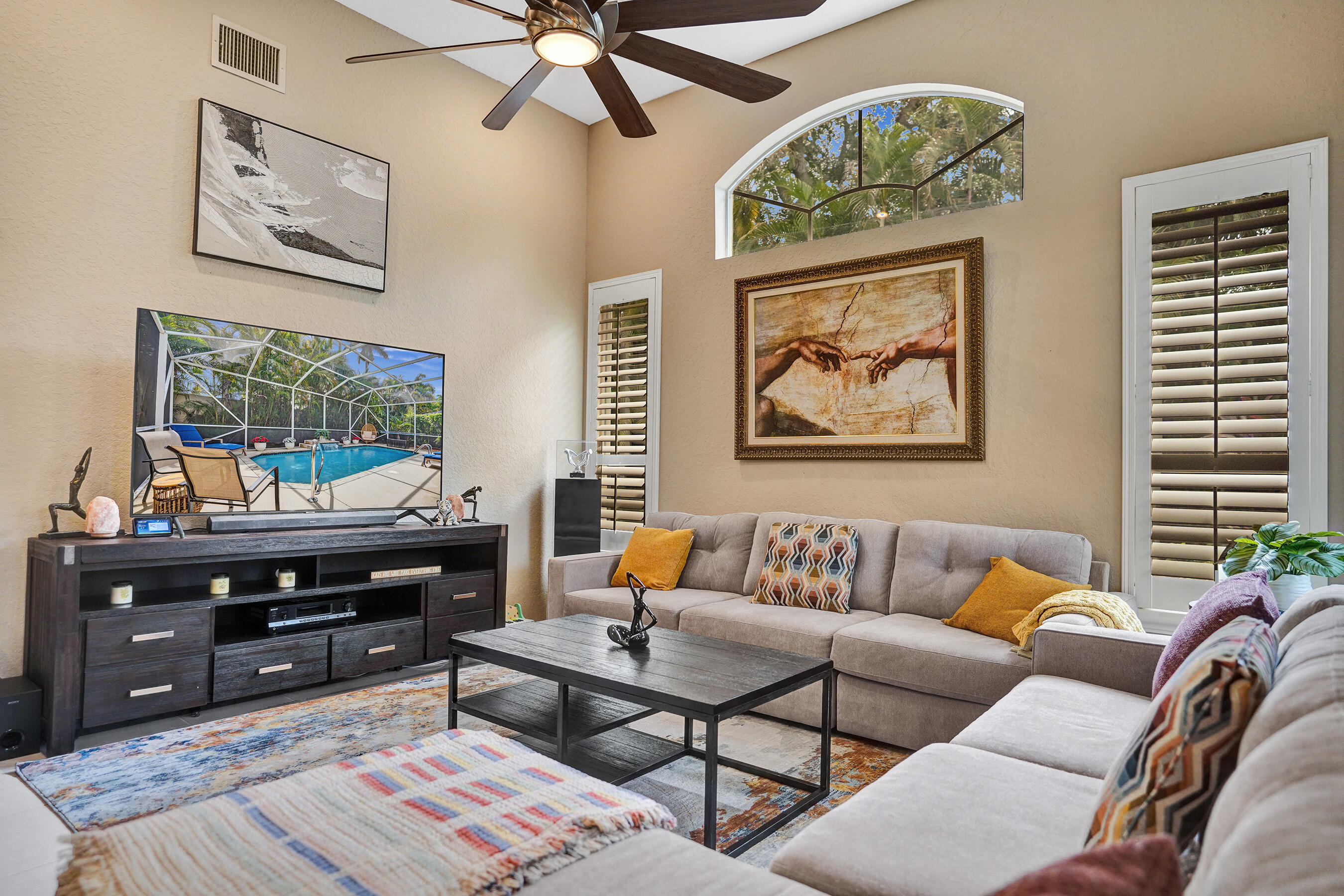 10063 Umberland Place Boca Raton, FL 33428 - Photo 17 of 97 a living room with furniture and a flat screen tv