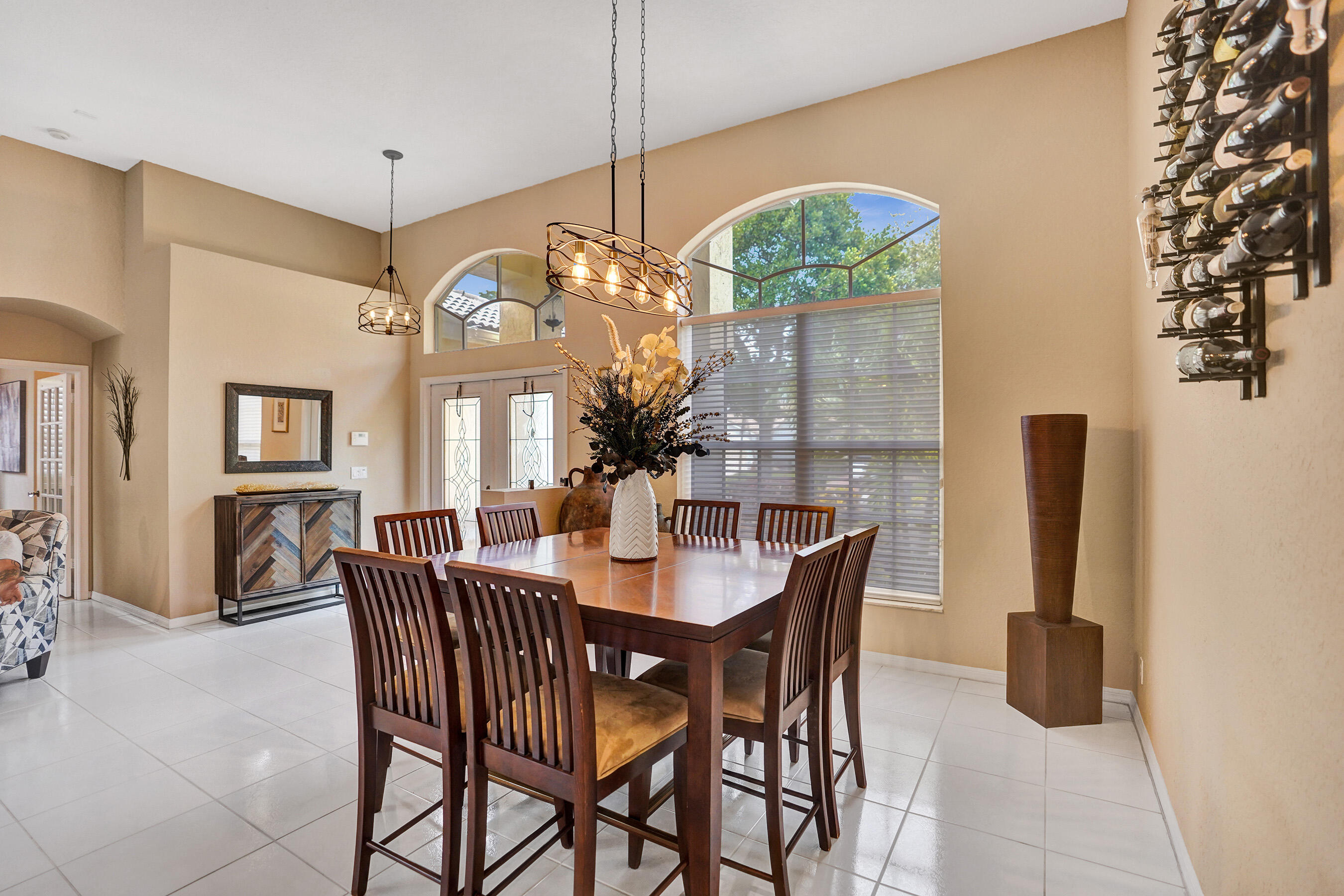 10063 Umberland Place Boca Raton, FL 33428 - Photo 32 of 97 a view of a dining room with furniture and a chandelier