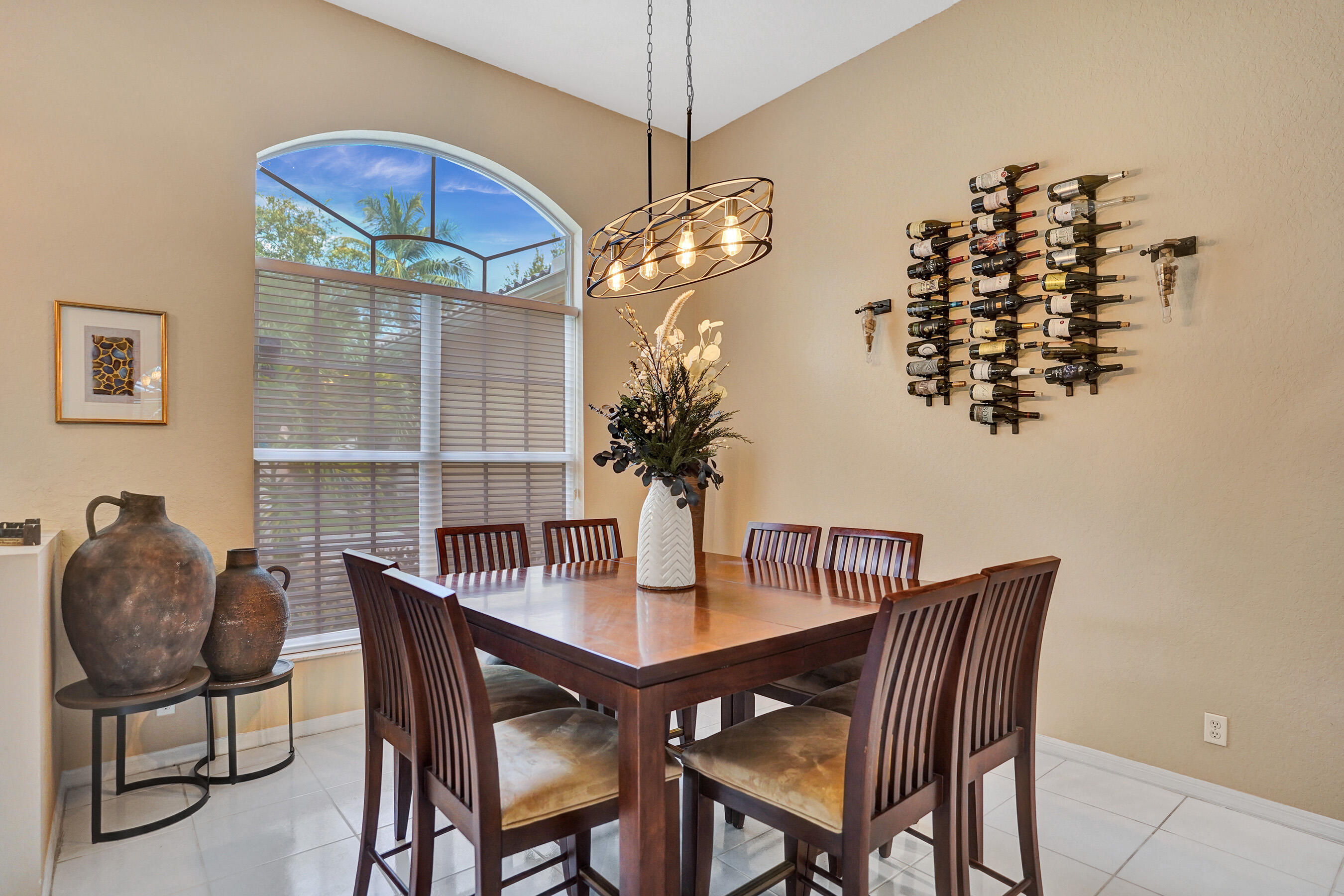 10063 Umberland Place Boca Raton, FL 33428 - Photo 33 of 97 a dining room with furniture and chandelier