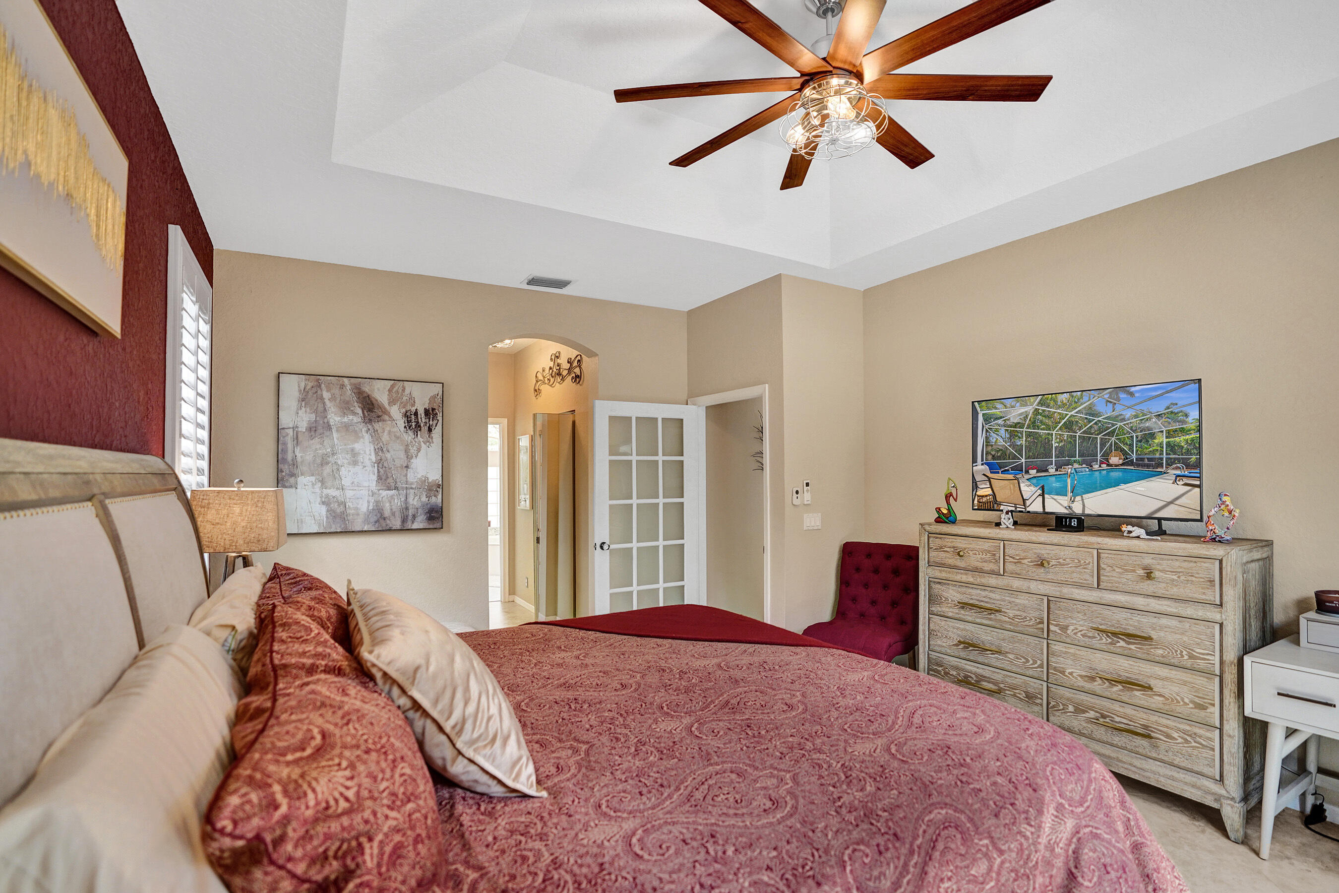 10063 Umberland Place Boca Raton, FL 33428 - Photo 39 of 97 a bed room with a bed and a dresser