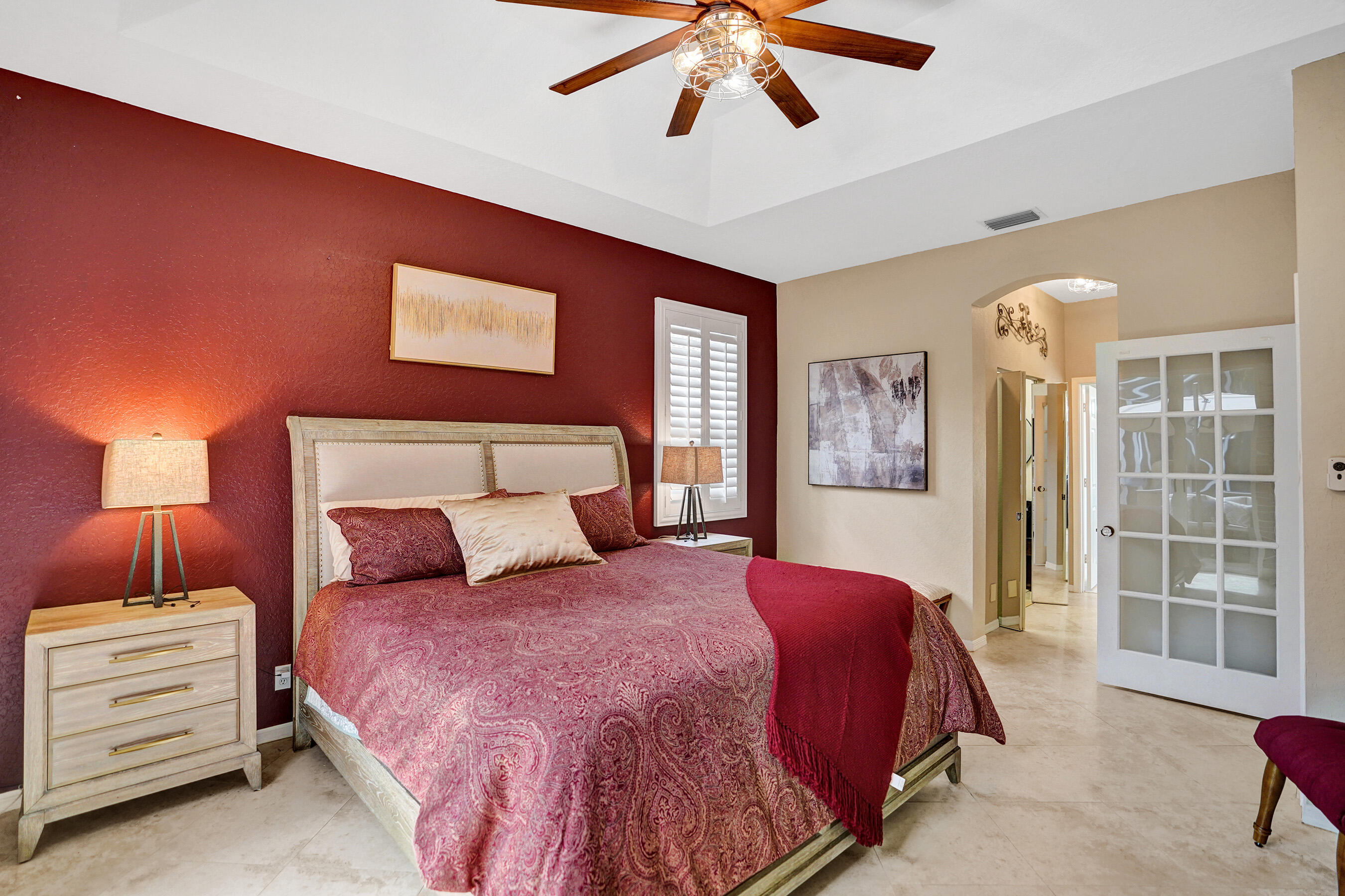 10063 Umberland Place Boca Raton, FL 33428 - Photo 40 of 97 a bedroom with a bed and a lamp