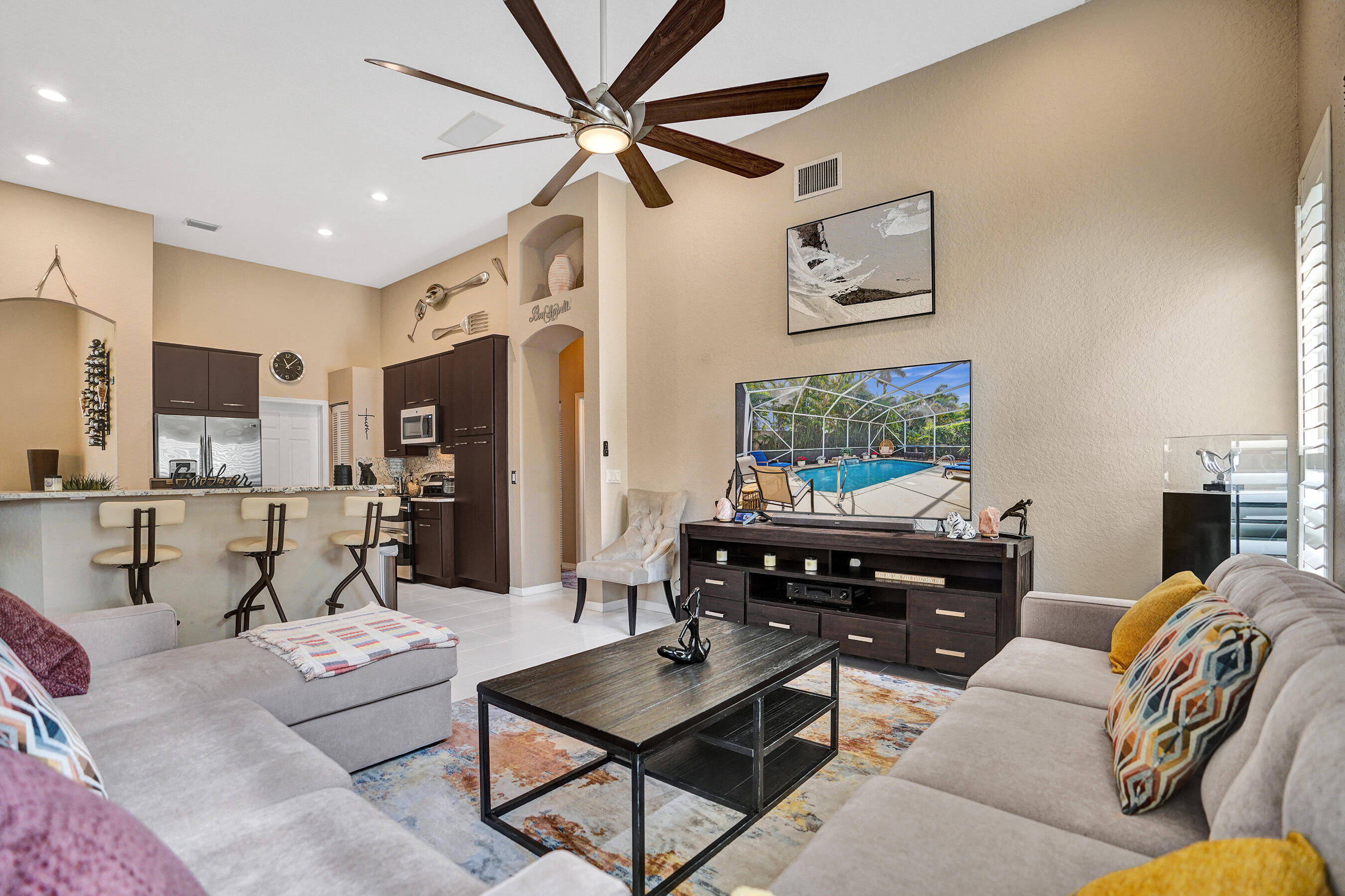 10063 Umberland Place Boca Raton, FL 33428 - Photo 4 of 97 a living room with furniture and a flat screen tv