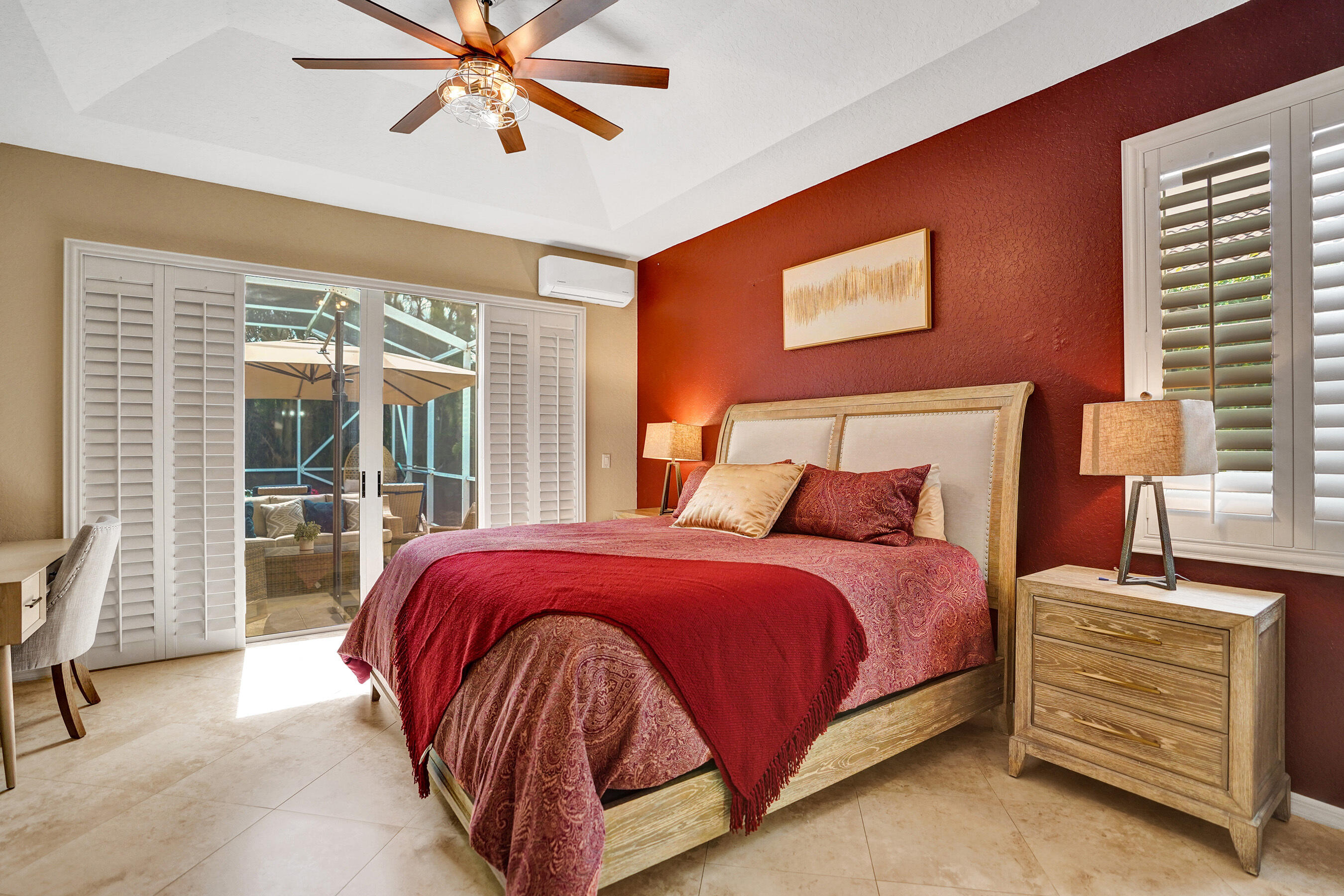 10063 Umberland Place Boca Raton, FL 33428 - Photo 41 of 97 a bedroom with a bed and glass door