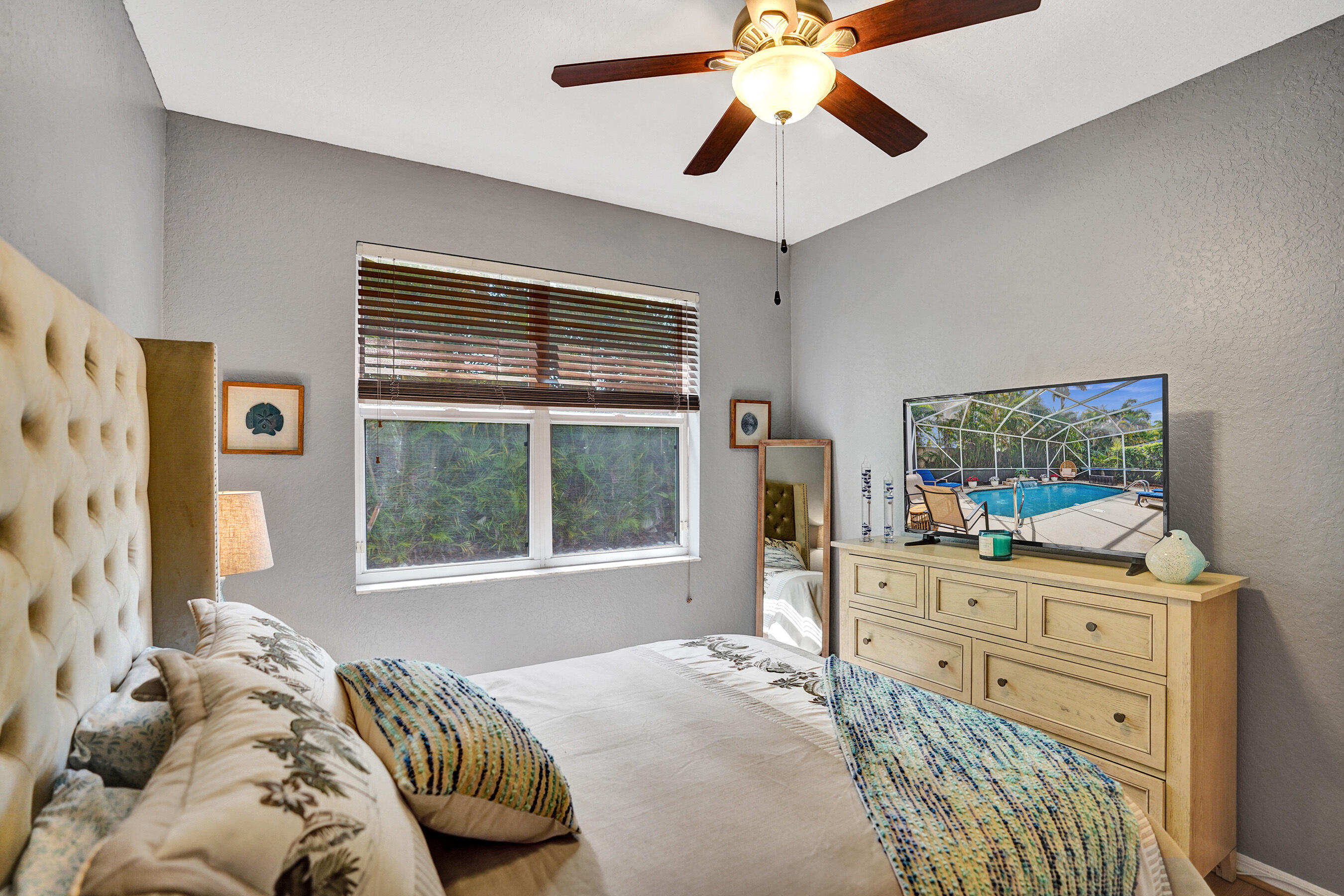 10063 Umberland Place Boca Raton, FL 33428 - Photo 54 of 97 a bedroom with a bed and a dresser