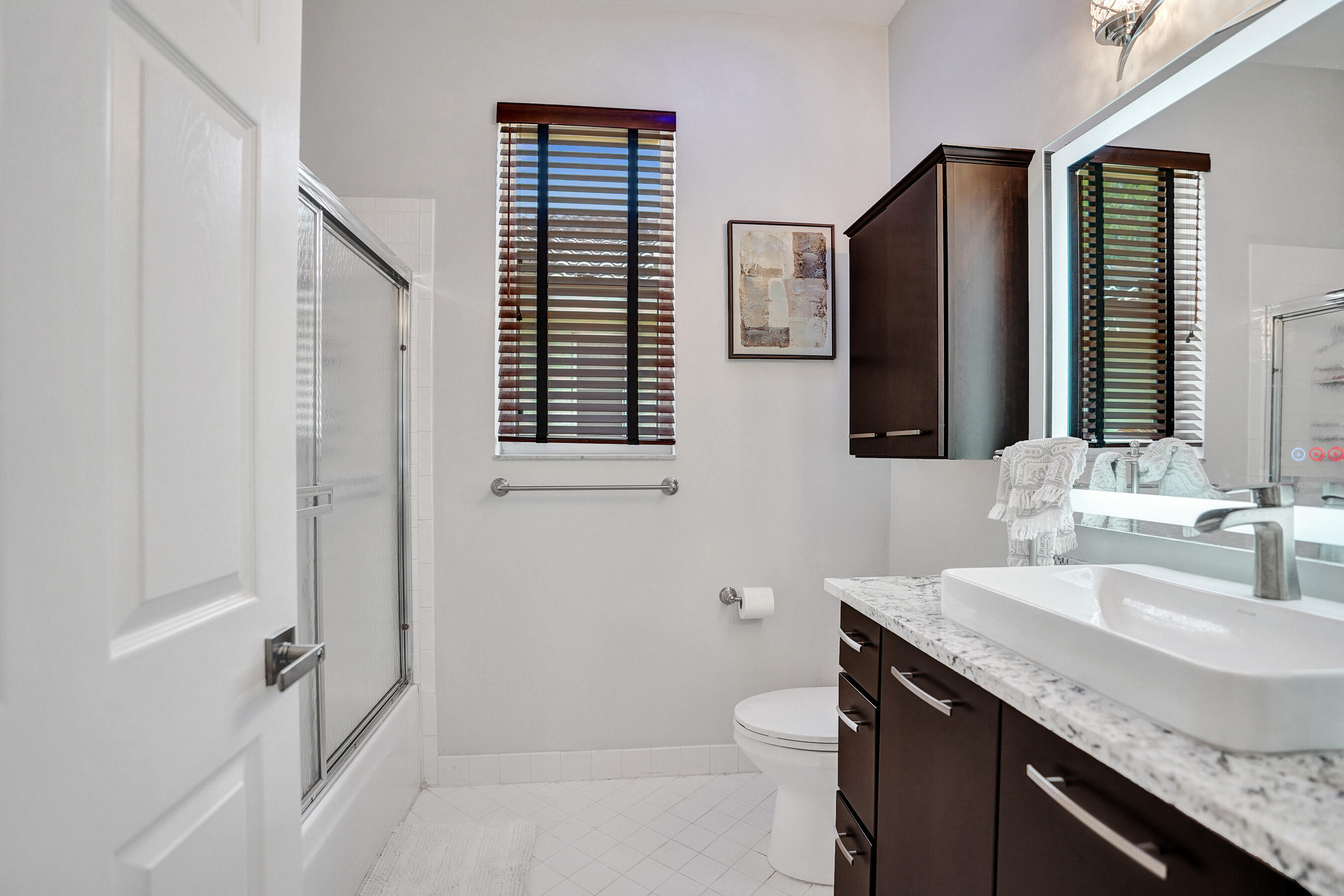 10063 Umberland Place Boca Raton, FL 33428 - Photo 57 of 97 a bathroom with a granite countertop sink toilet and shower