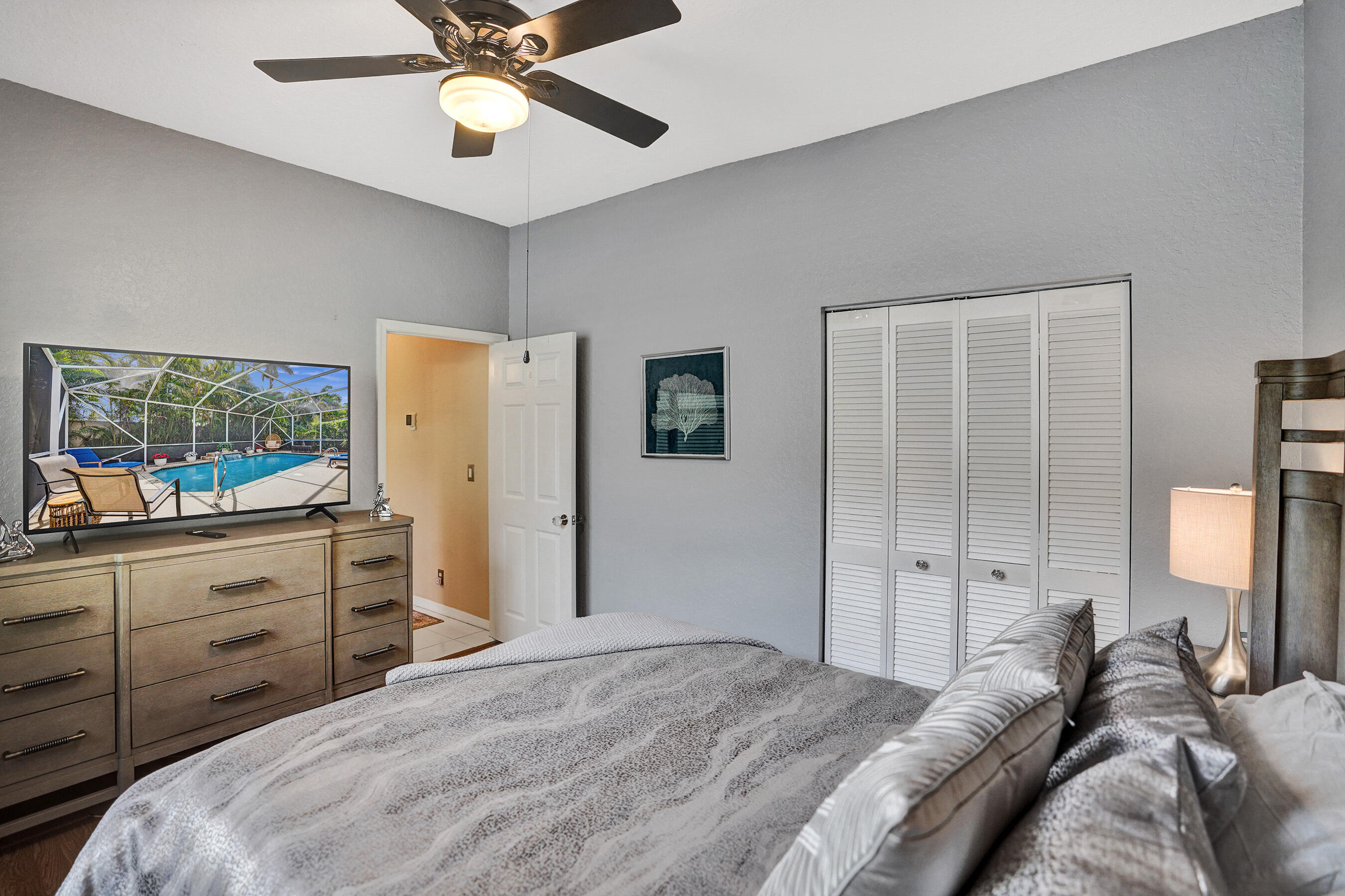 10063 Umberland Place Boca Raton, FL 33428 - Photo 60 of 97 a bed room with a bed and a mirror