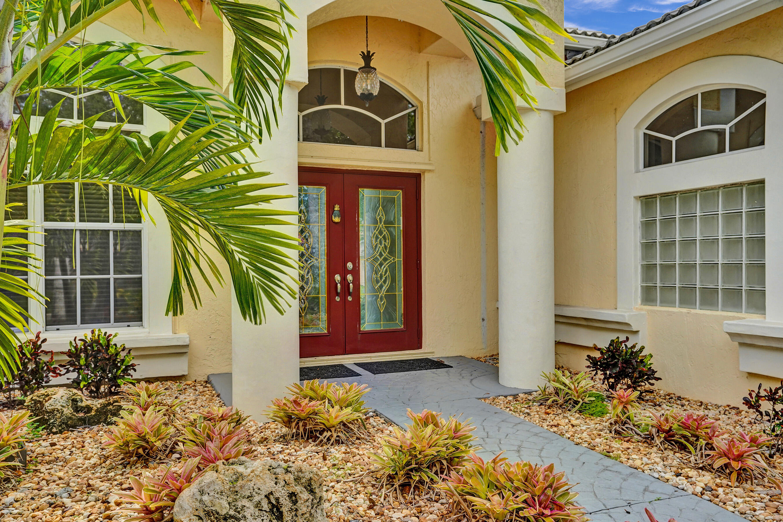 10063 Umberland Place Boca Raton, FL 33428 - Photo 64 of 97 a front view of a house with a yard