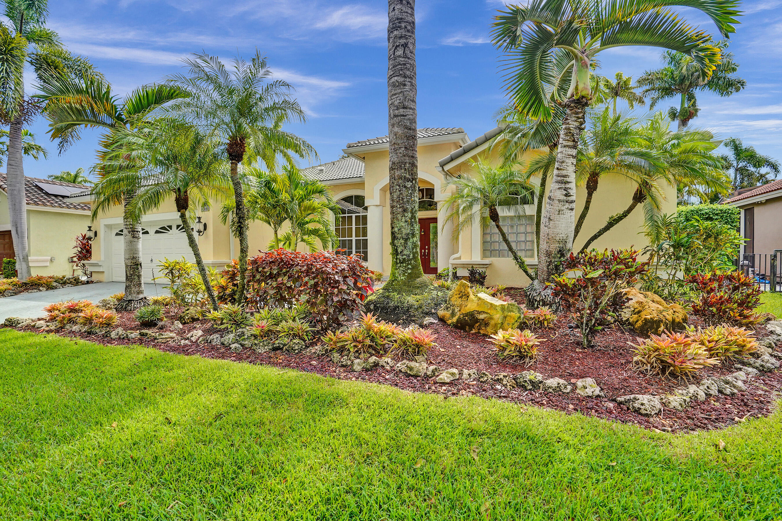 10063 Umberland Place Boca Raton, FL 33428 - Photo 70 of 97 a view of a garden with a fountain
