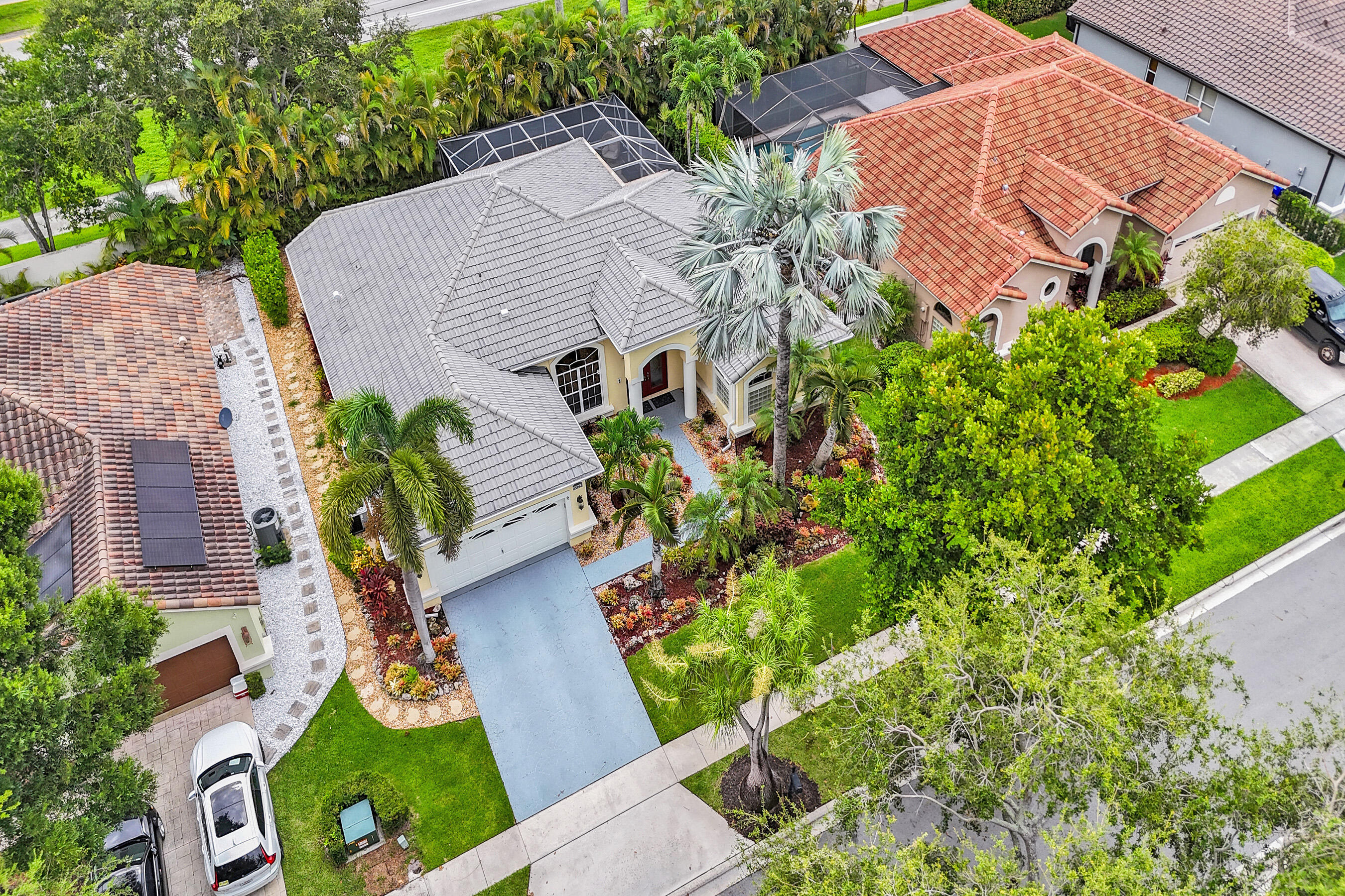 10063 Umberland Place Boca Raton, FL 33428 - Photo 82 of 97 an aerial view of a house with garden space and street view